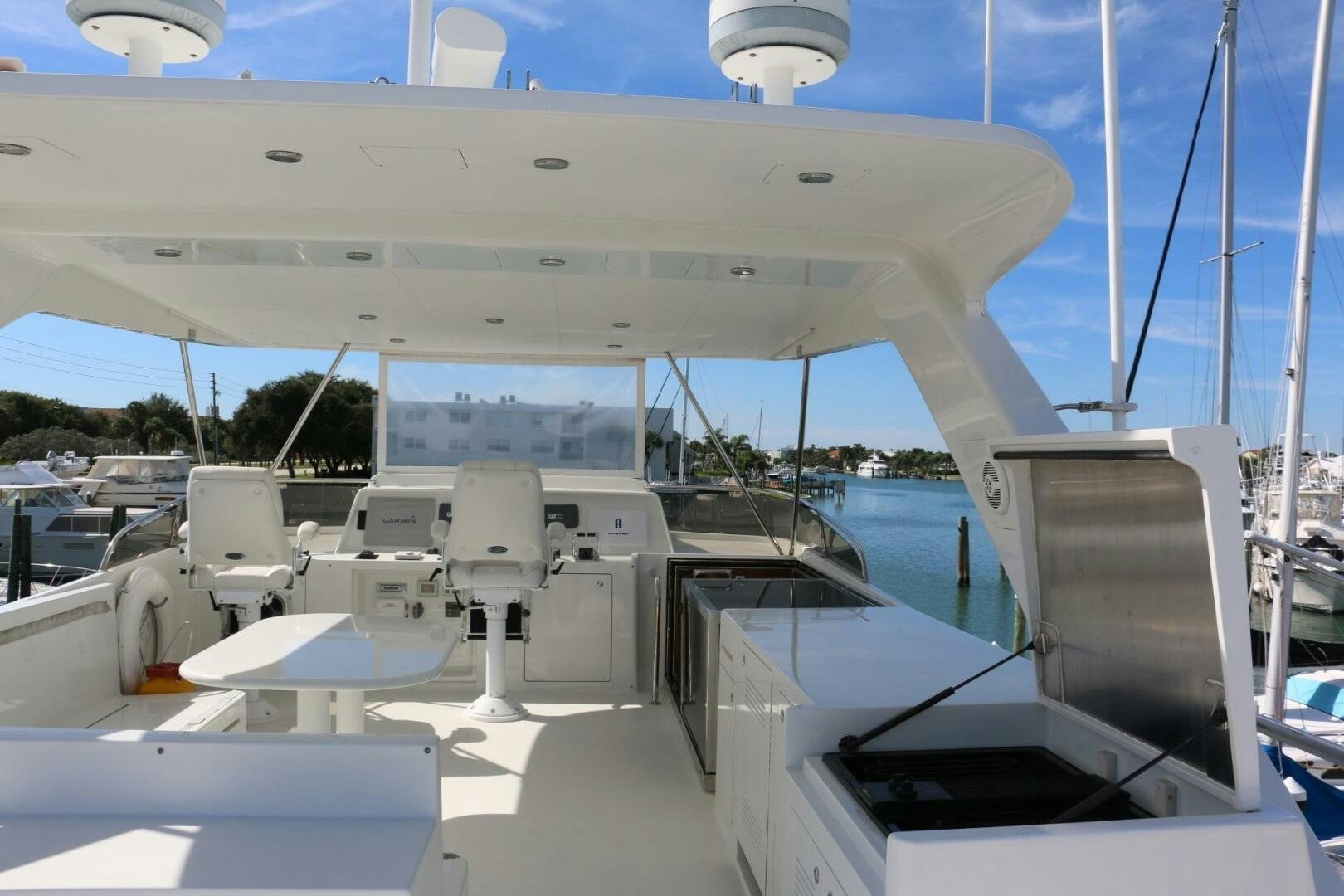a large white ship with chairs aboard RECYCLING MADE CENTS Yacht for Sale