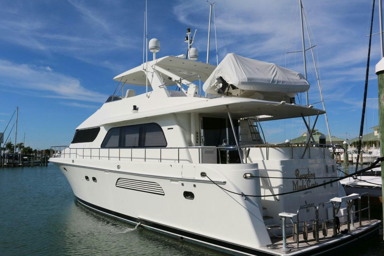a white yacht in the water aboard RECYCLING MADE CENTS Yacht for Sale