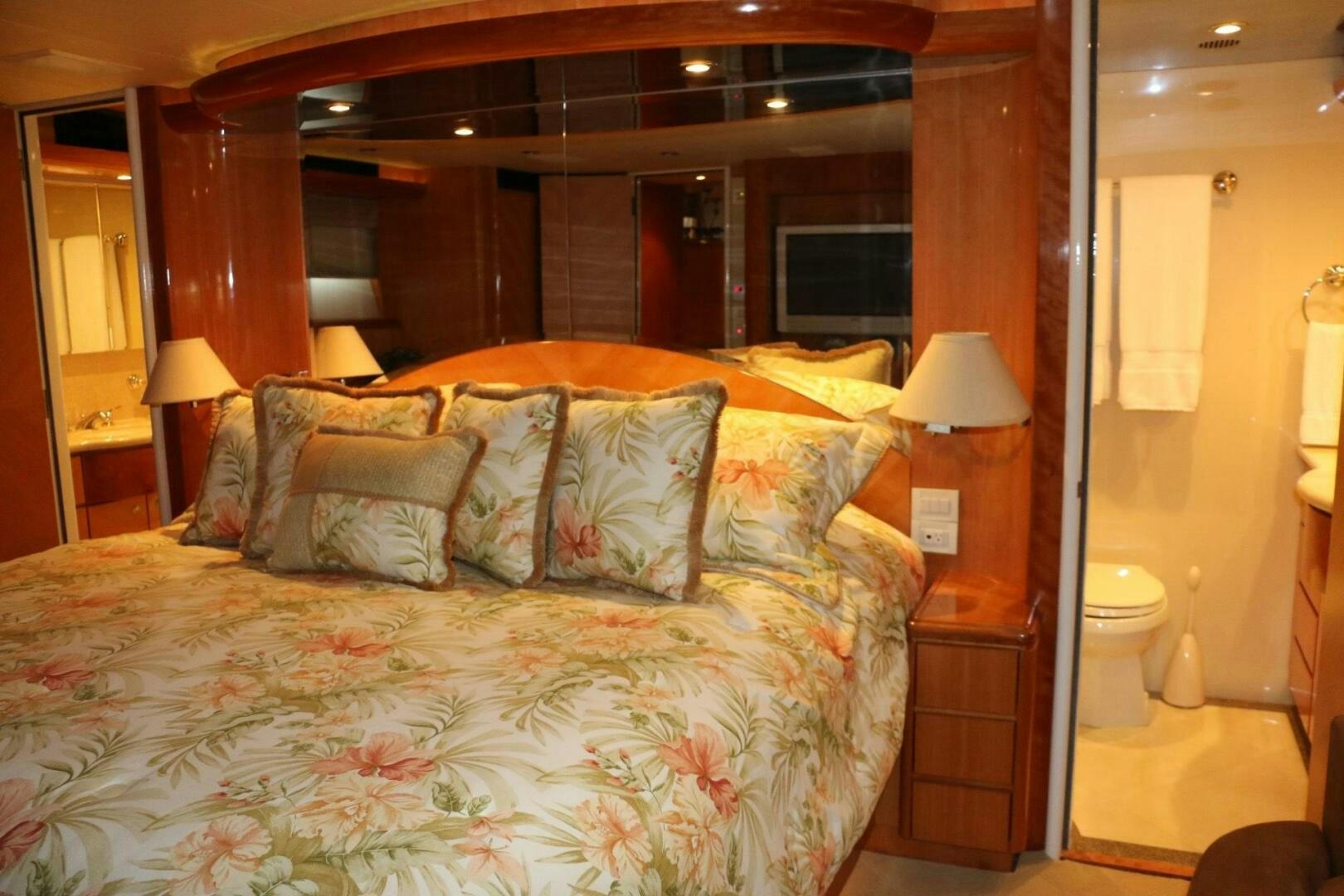 a bed with a large mirror above it aboard RECYCLING MADE CENTS Yacht for Sale