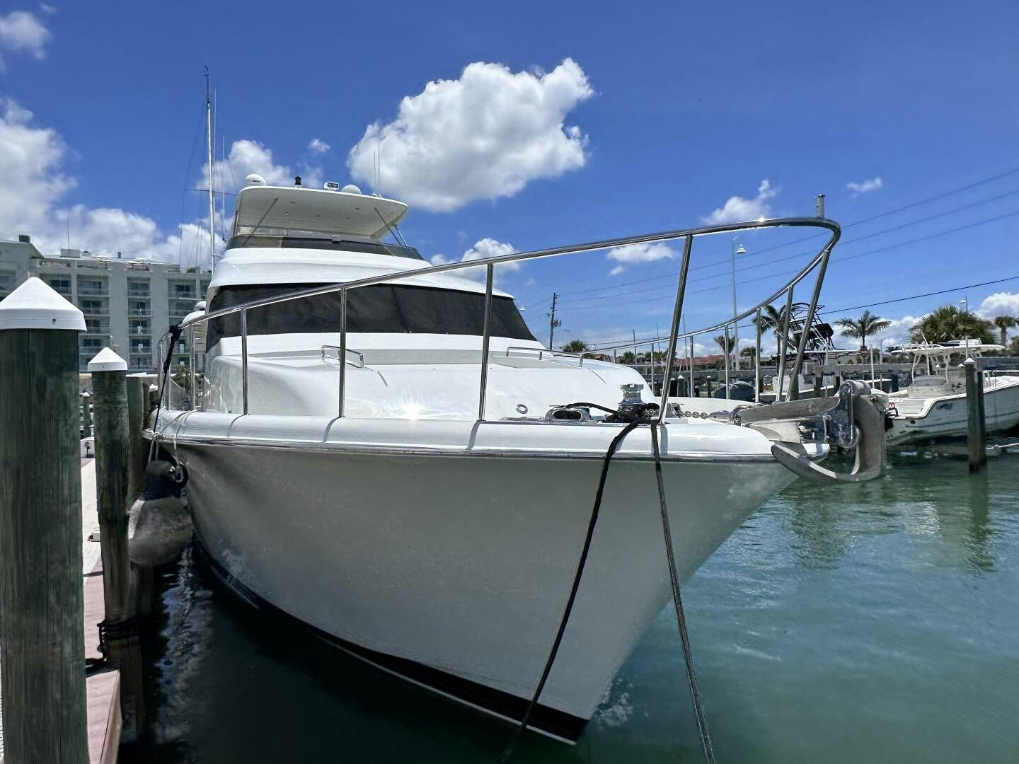 a white boat docked aboard RECYCLING MADE CENTS Yacht for Sale