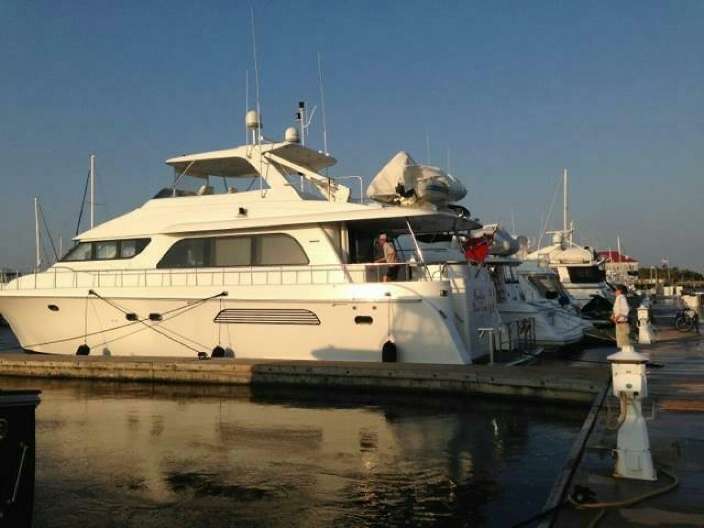 a boat docked at a pier aboard RECYCLING MADE CENTS Yacht for Sale