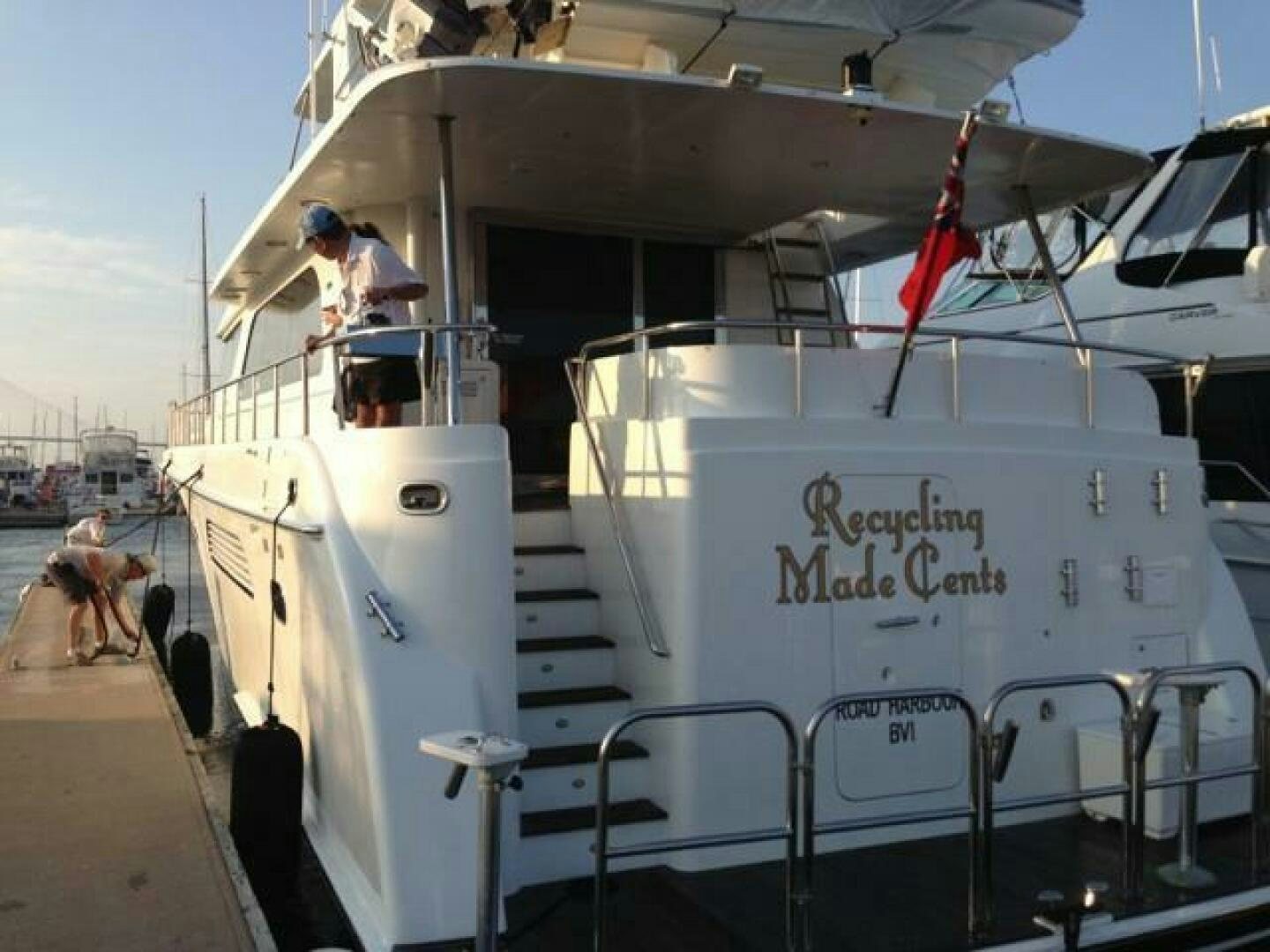 a boat with people on it aboard RECYCLING MADE CENTS Yacht for Sale