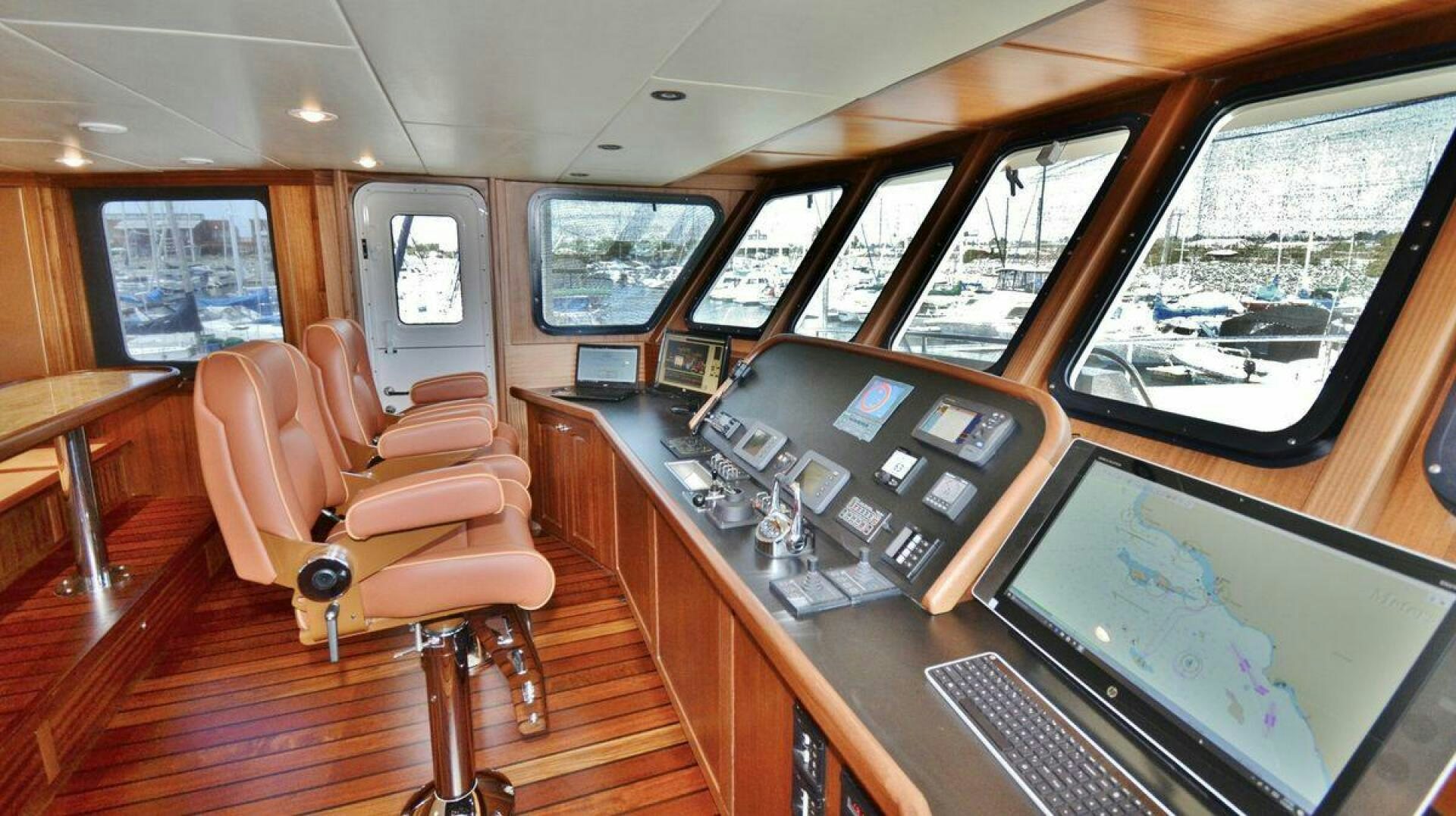 a room with a table and chairs aboard ALLSEAS Yacht for Sale
