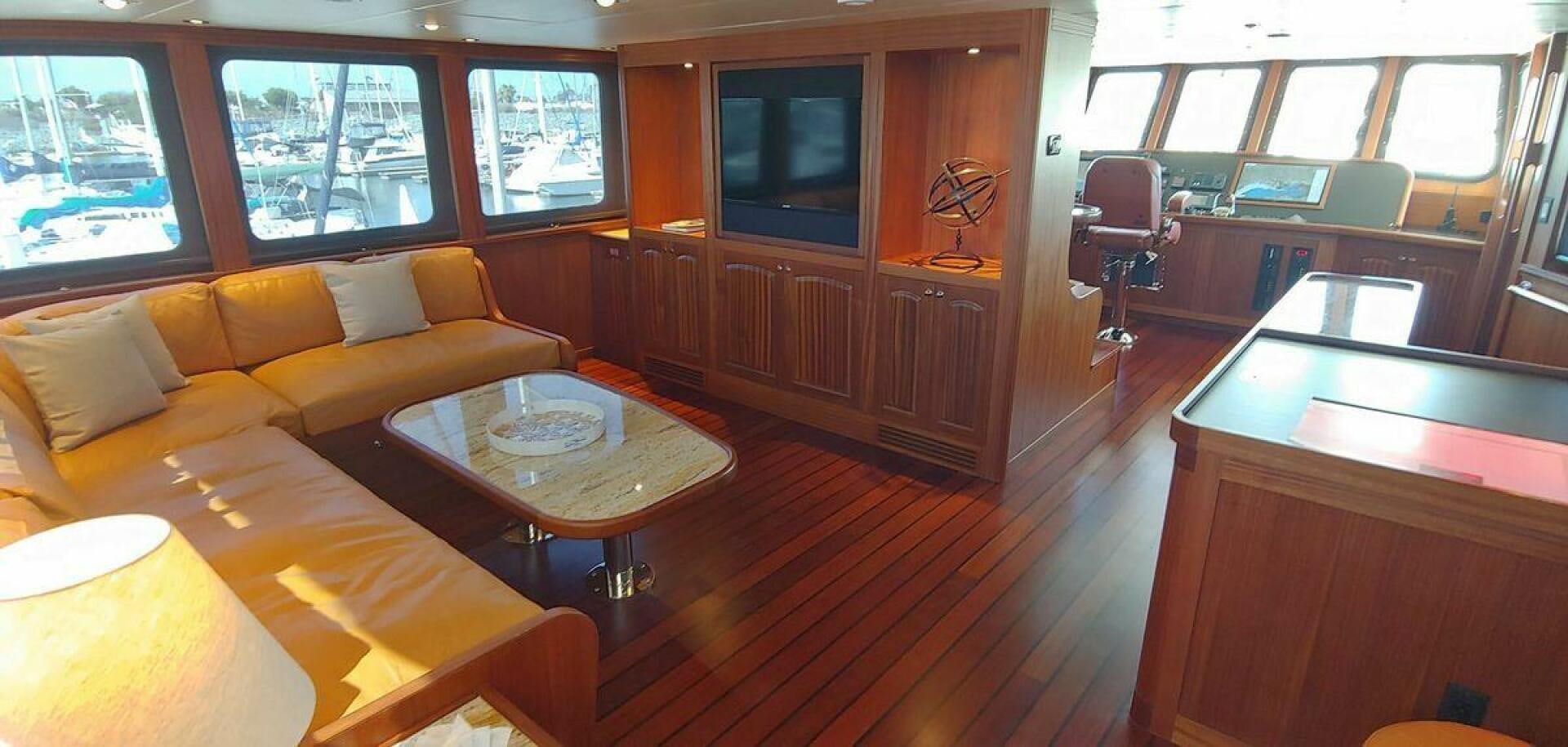 a living room with a wood floor aboard ALLSEAS Yacht for Sale