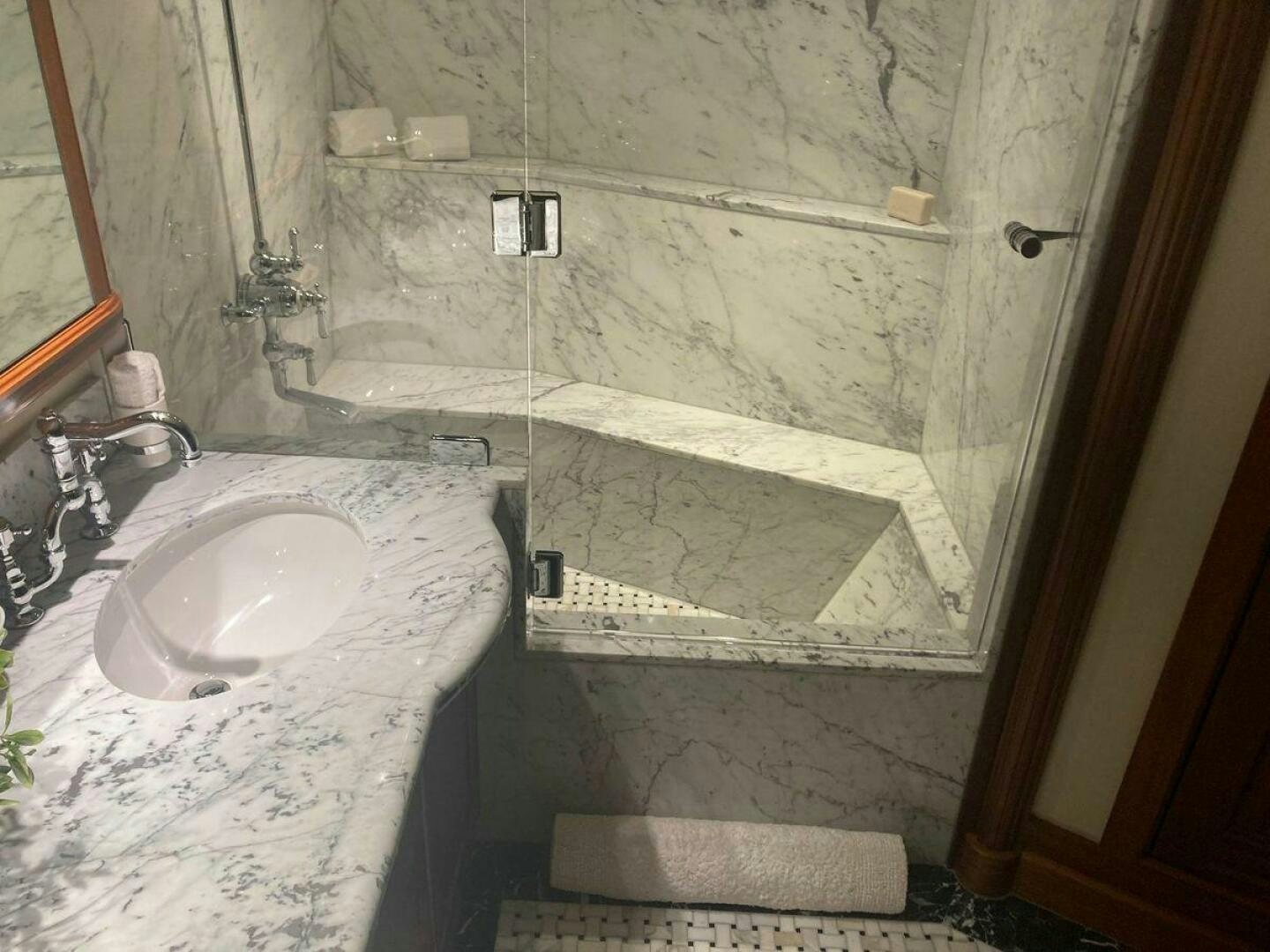 a bathroom with a sink and a shower aboard ALLSEAS Yacht for Sale