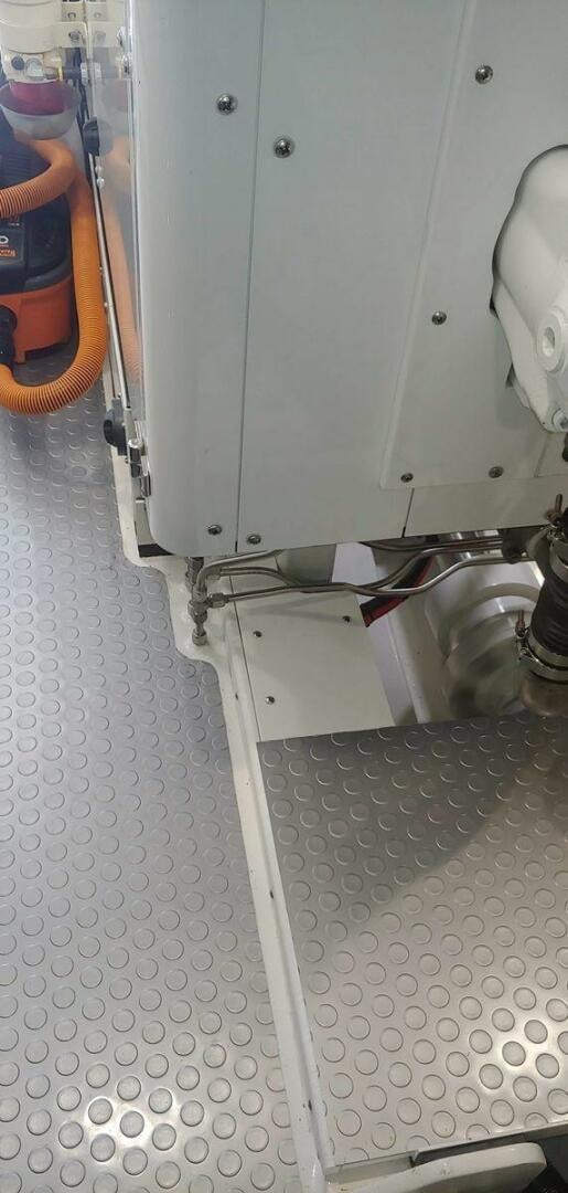 a person standing next to a machine aboard ALLSEAS Yacht for Sale