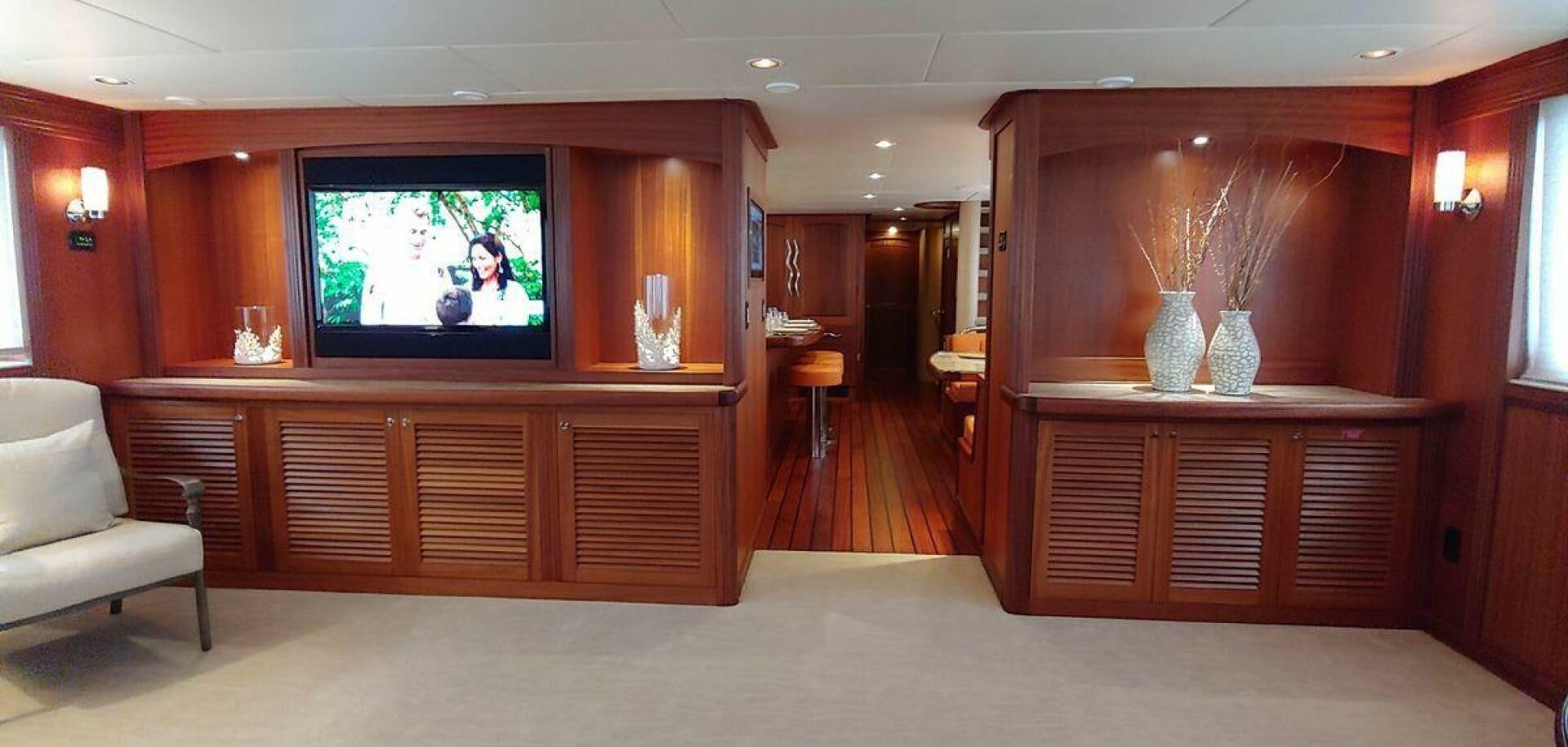a room with a tv and cabinets aboard ALLSEAS Yacht for Sale