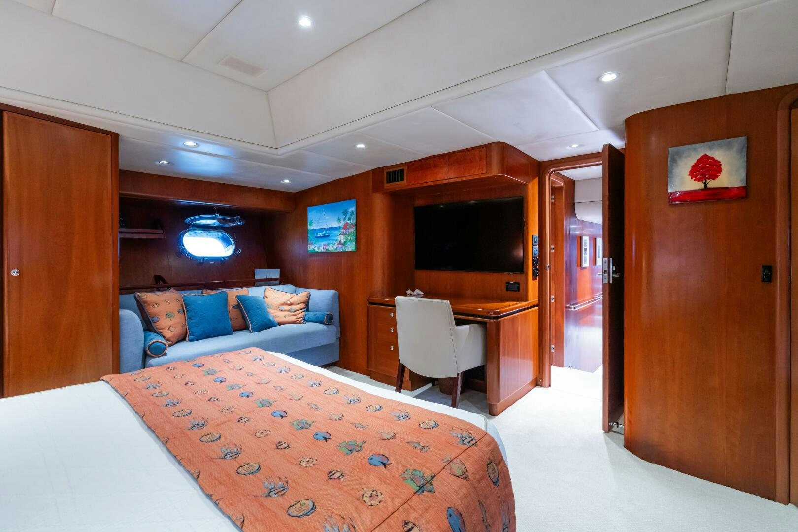 a bedroom with a bed and desk aboard SEAQUELL Yacht for Sale