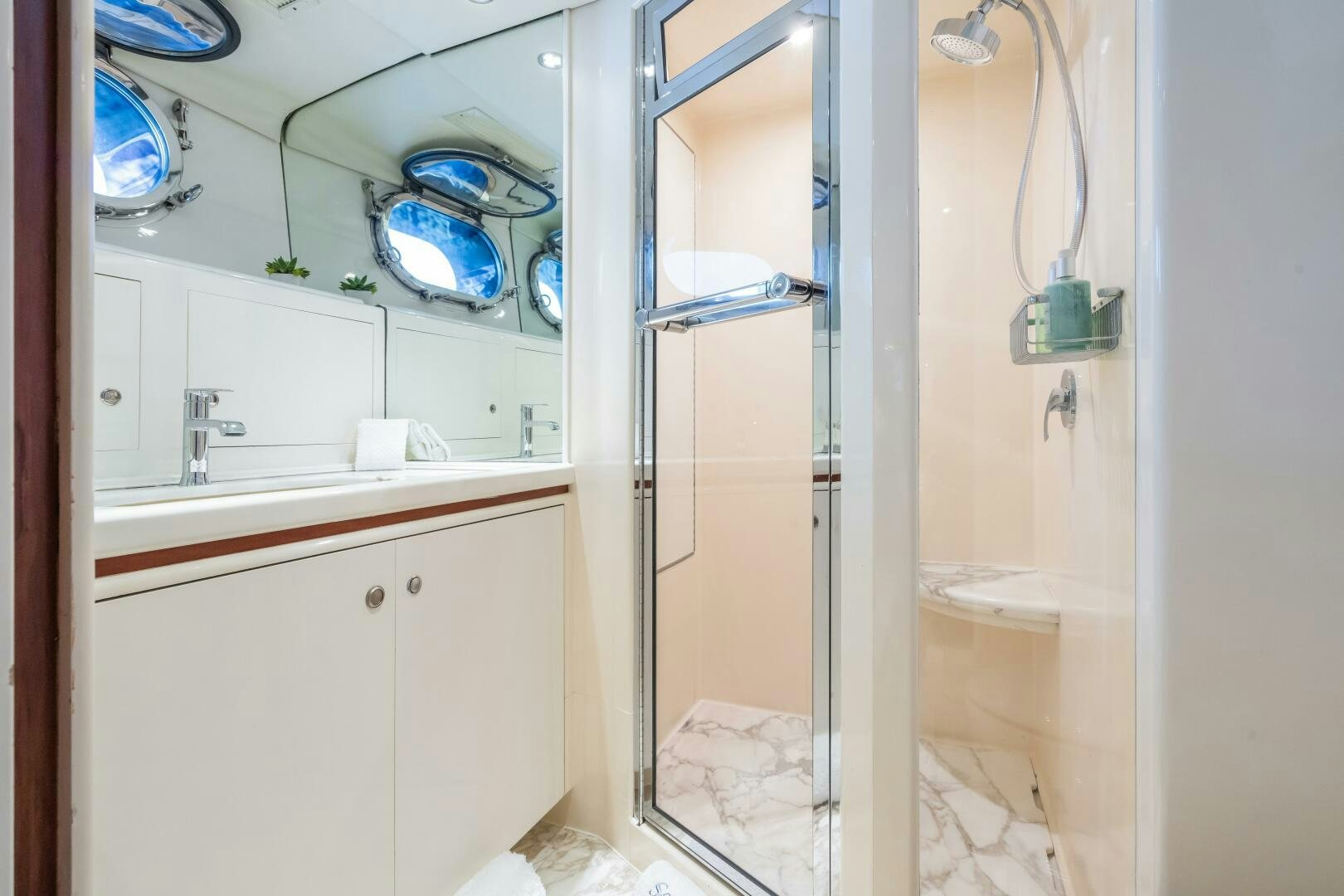a bathroom with a sink and a shower aboard SEAQUELL Yacht for Sale