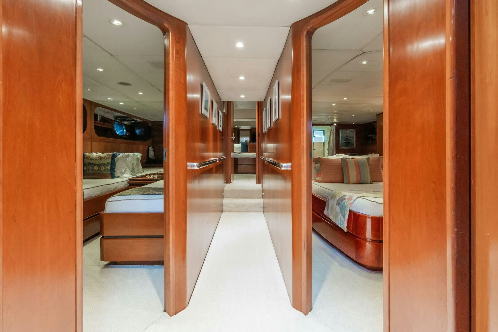 a room with a bed and a mirror aboard SEAQUELL Yacht for Sale