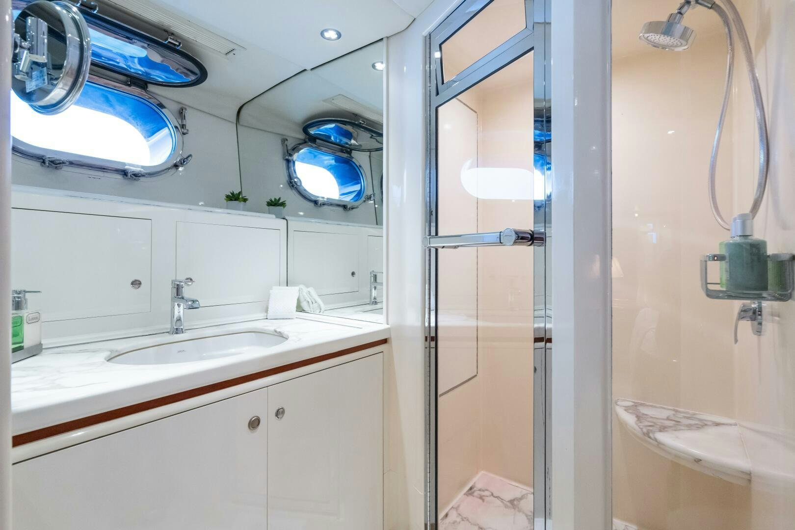 a bathroom with a shower and sink aboard SEAQUELL Yacht for Sale