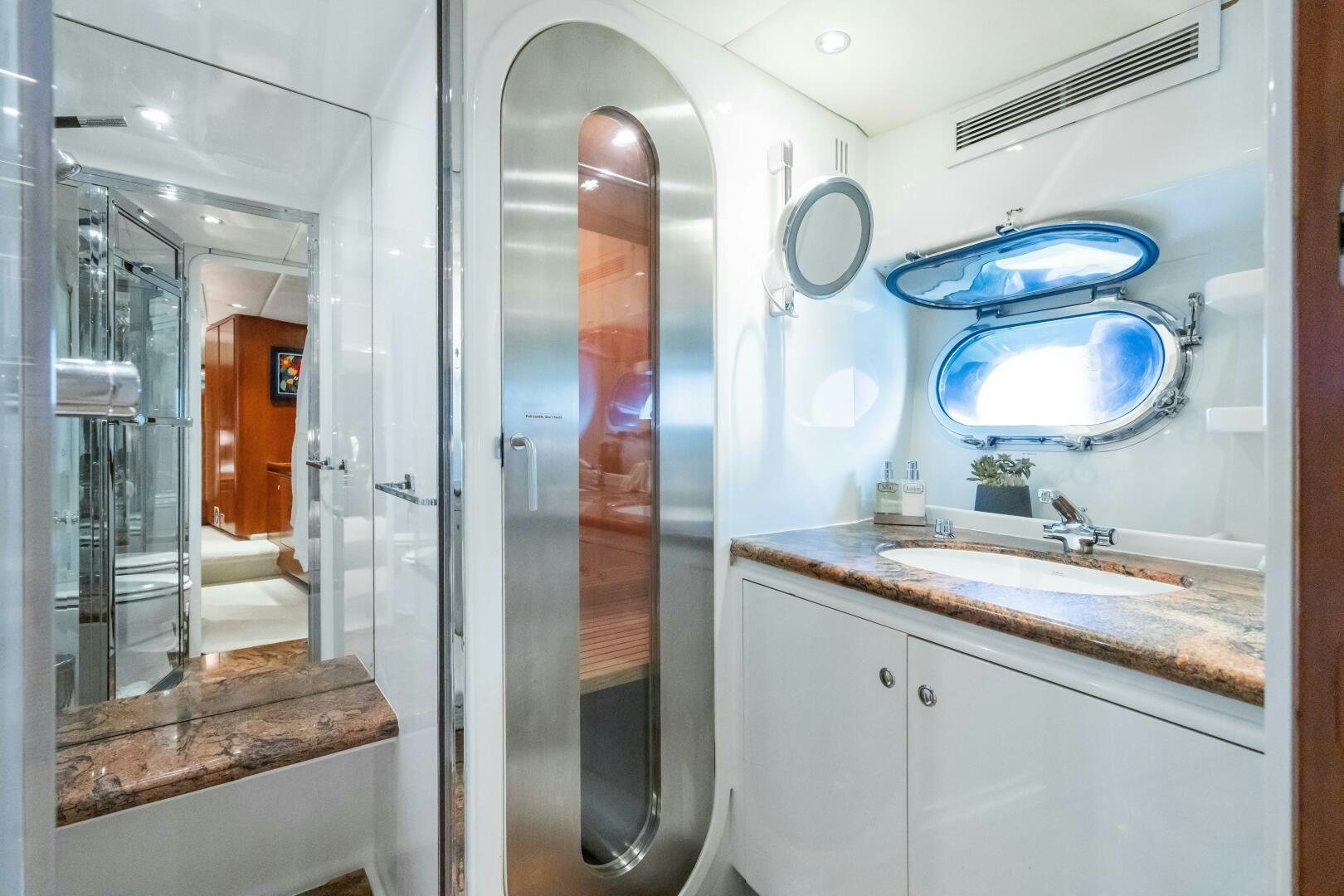 a bathroom with a sink and mirrors aboard SEAQUELL Yacht for Sale