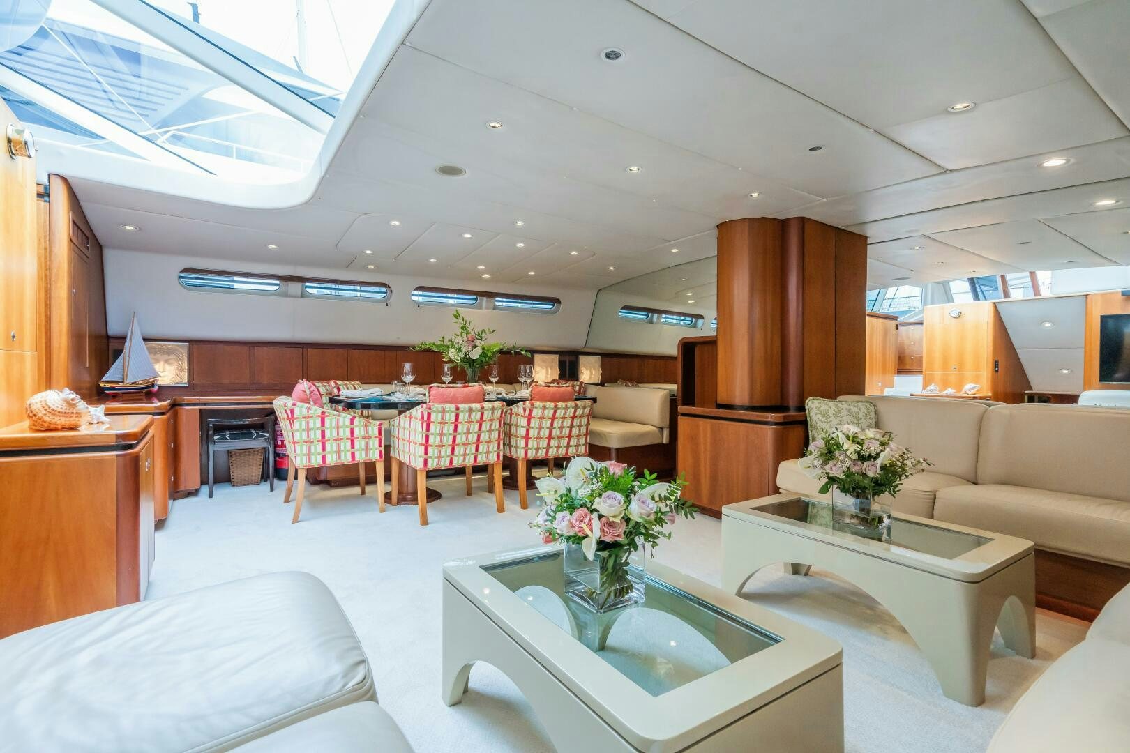 a large room with a table and chairs aboard SEAQUELL Yacht for Sale