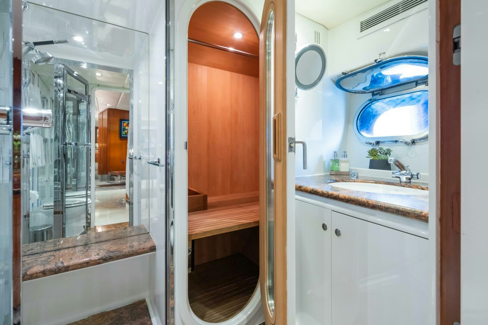 a bathroom with a sink and a mirror aboard SEAQUELL Yacht for Sale