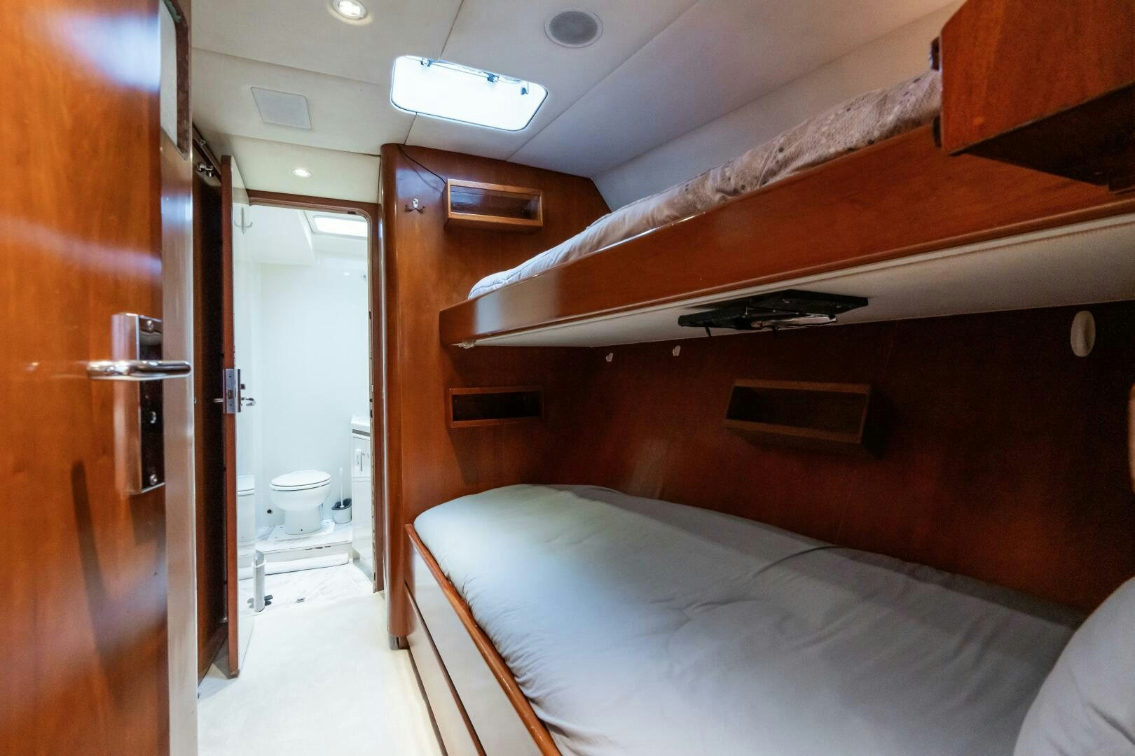 a room with a bed and a closet aboard SEAQUELL Yacht for Sale