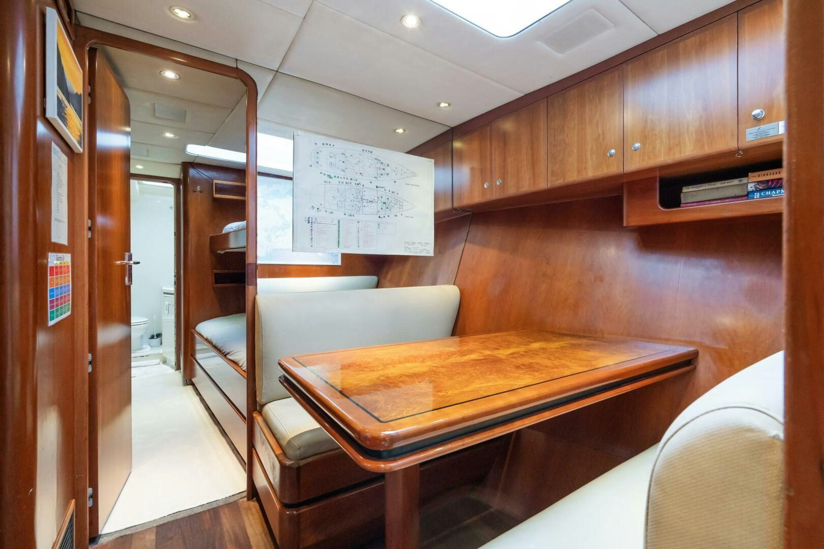 a room with a table and chairs aboard SEAQUELL Yacht for Sale