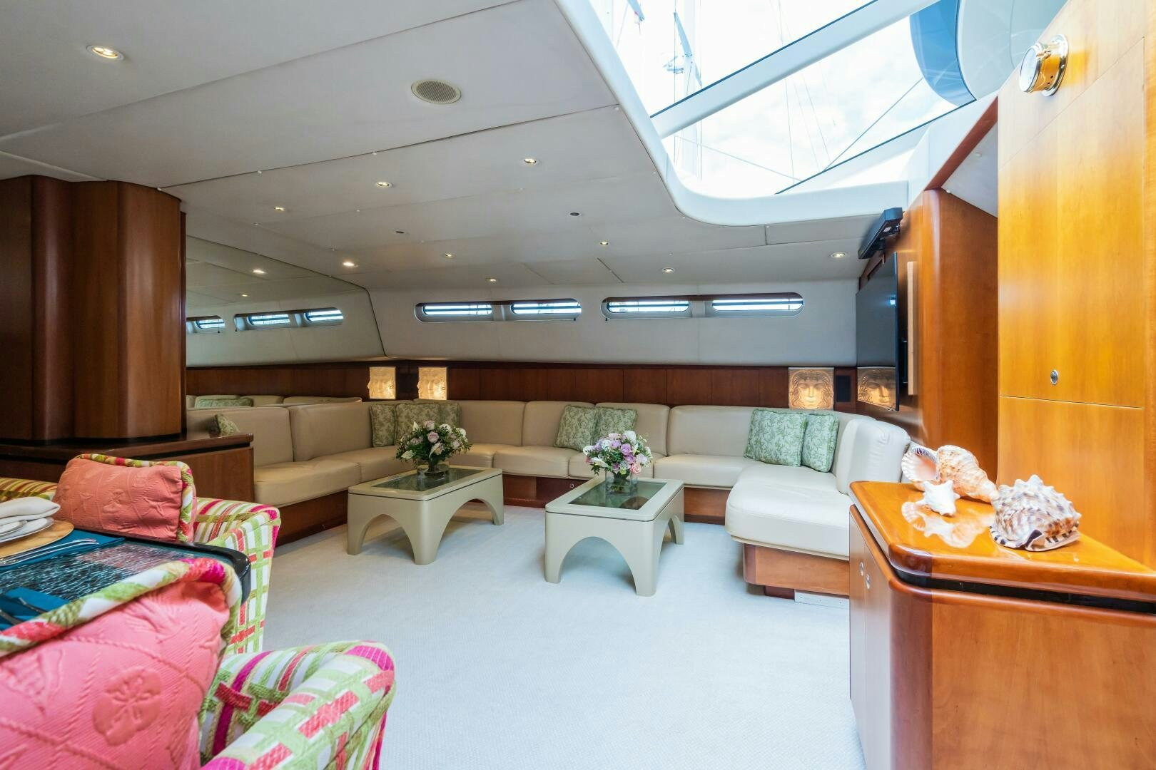 a living room with a couch and a coffee table aboard SEAQUELL Yacht for Sale