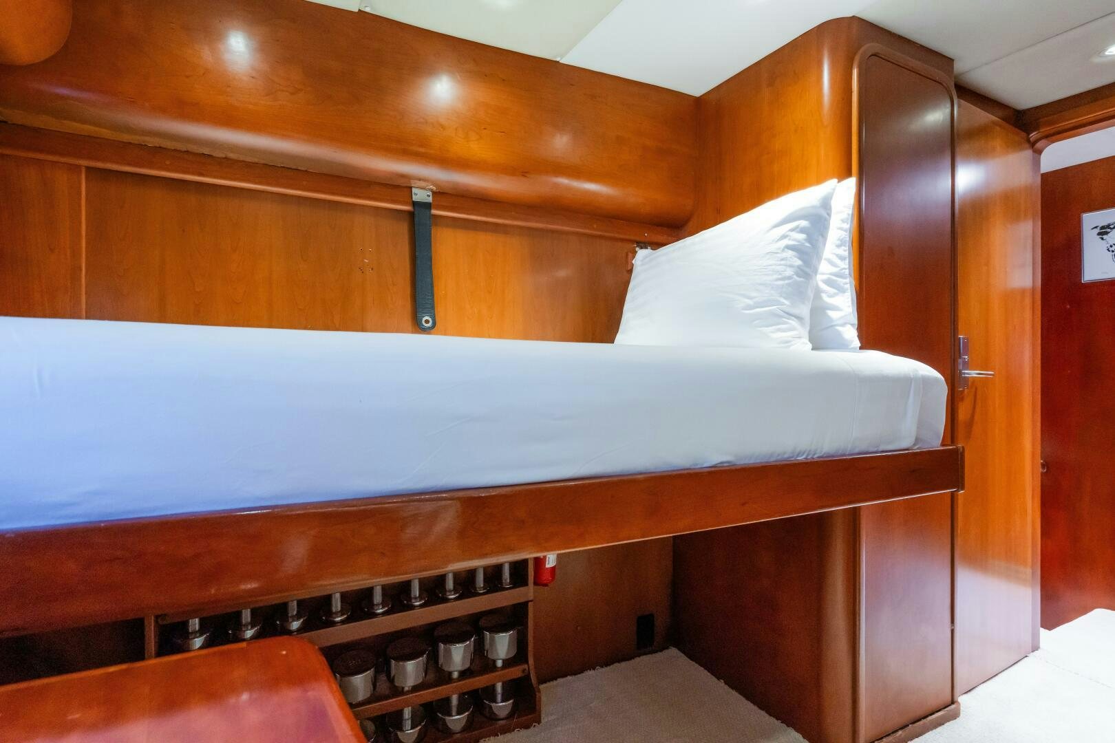 a bed with a white sheet aboard SEAQUELL Yacht for Sale