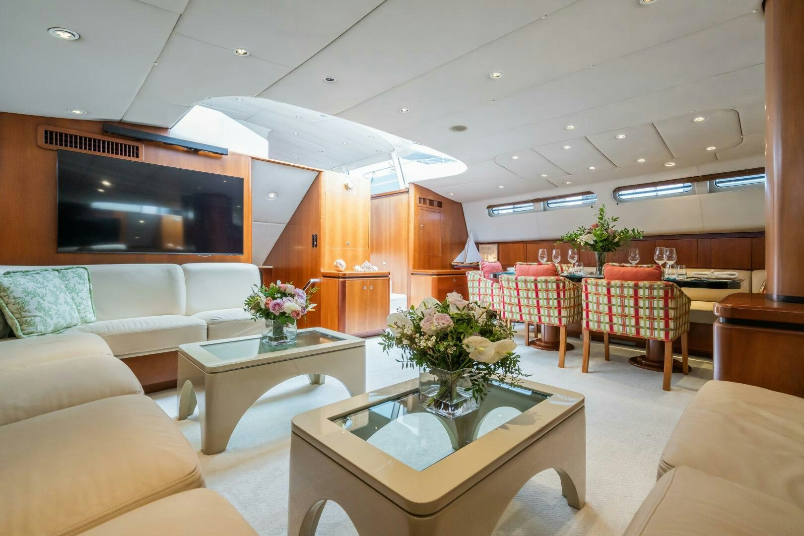 a living room with a table and chairs aboard SEAQUELL Yacht for Sale