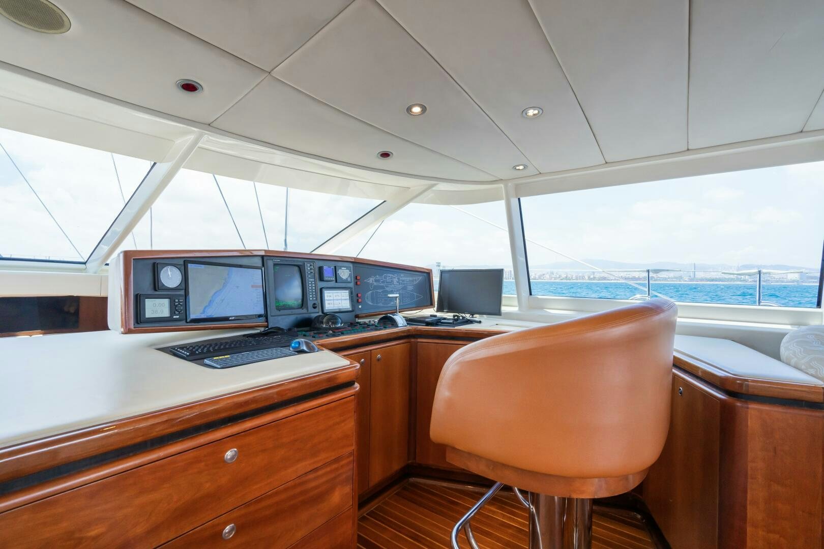 a room with a desk and computers aboard SEAQUELL Yacht for Sale