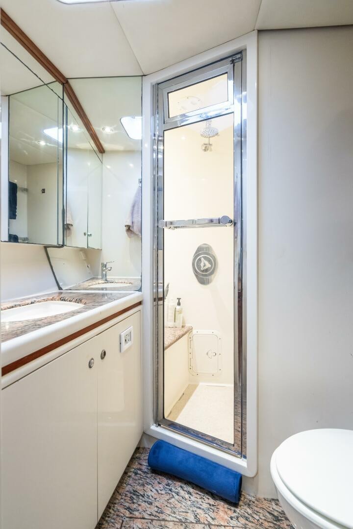 a bathroom with a glass shower aboard SEAQUELL Yacht for Sale