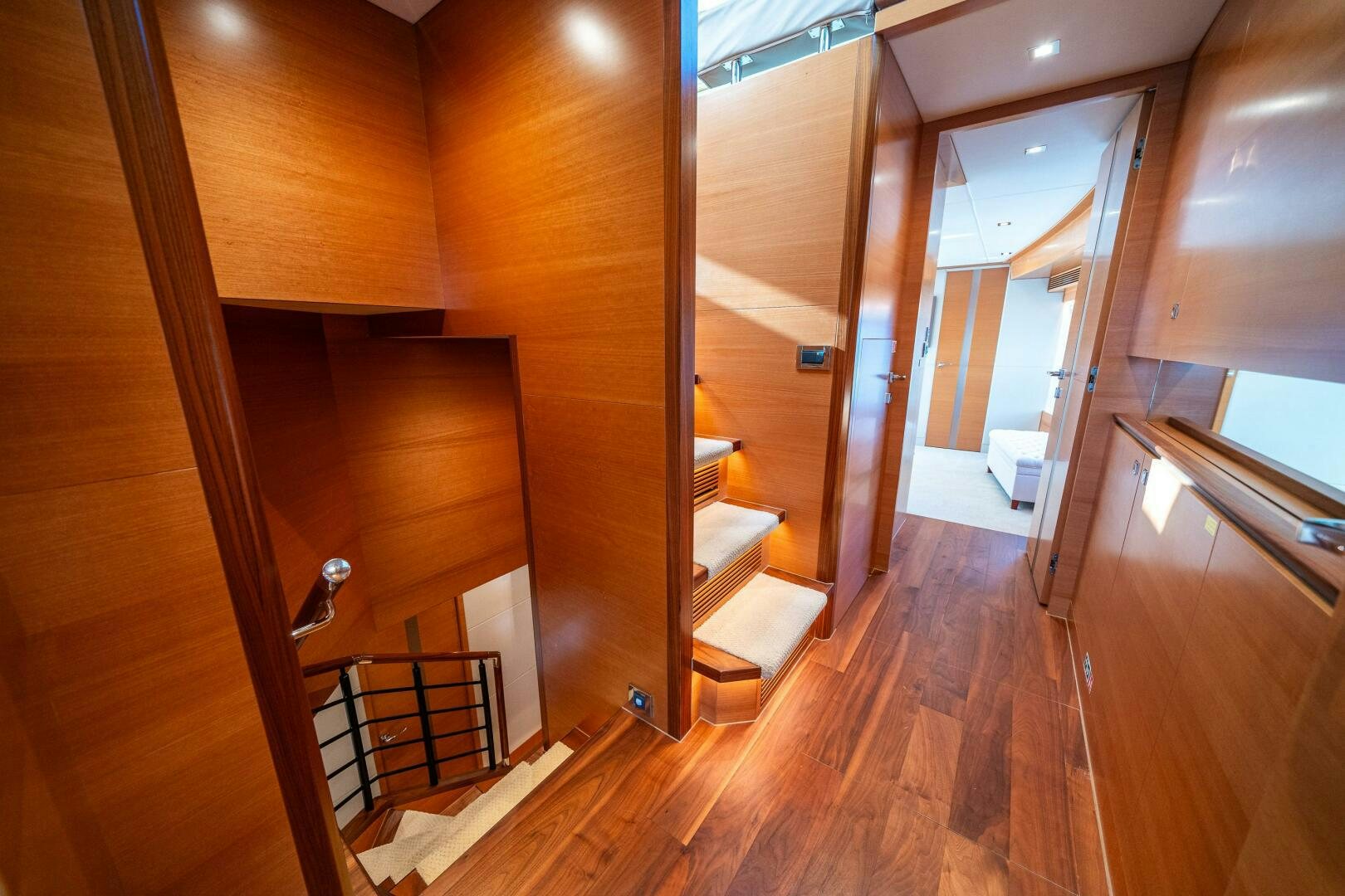a room with wooden walls and a staircase aboard MIDNIGHT MOON Yacht for Sale