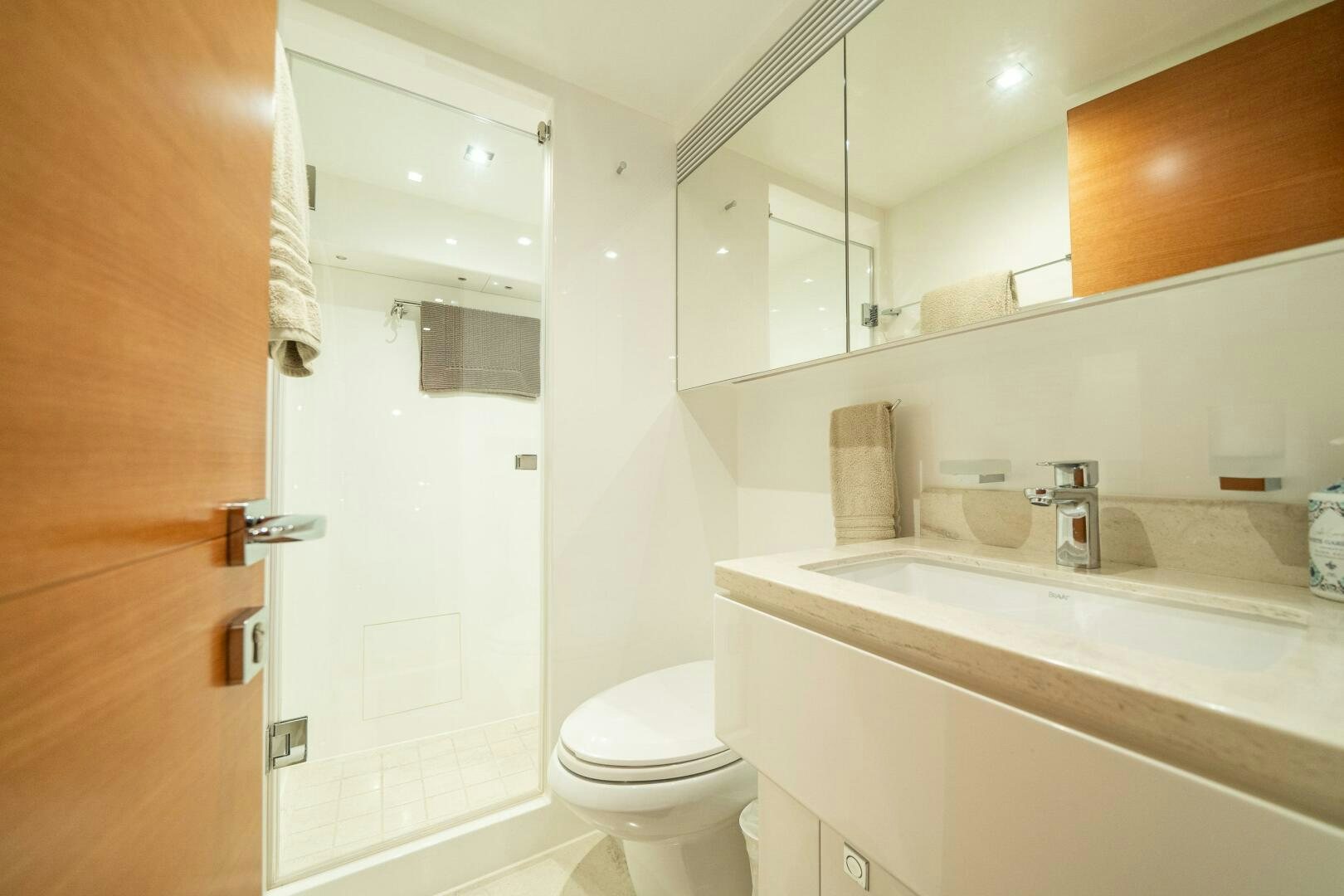 a bathroom with a toilet and a sink aboard MIDNIGHT MOON Yacht for Sale