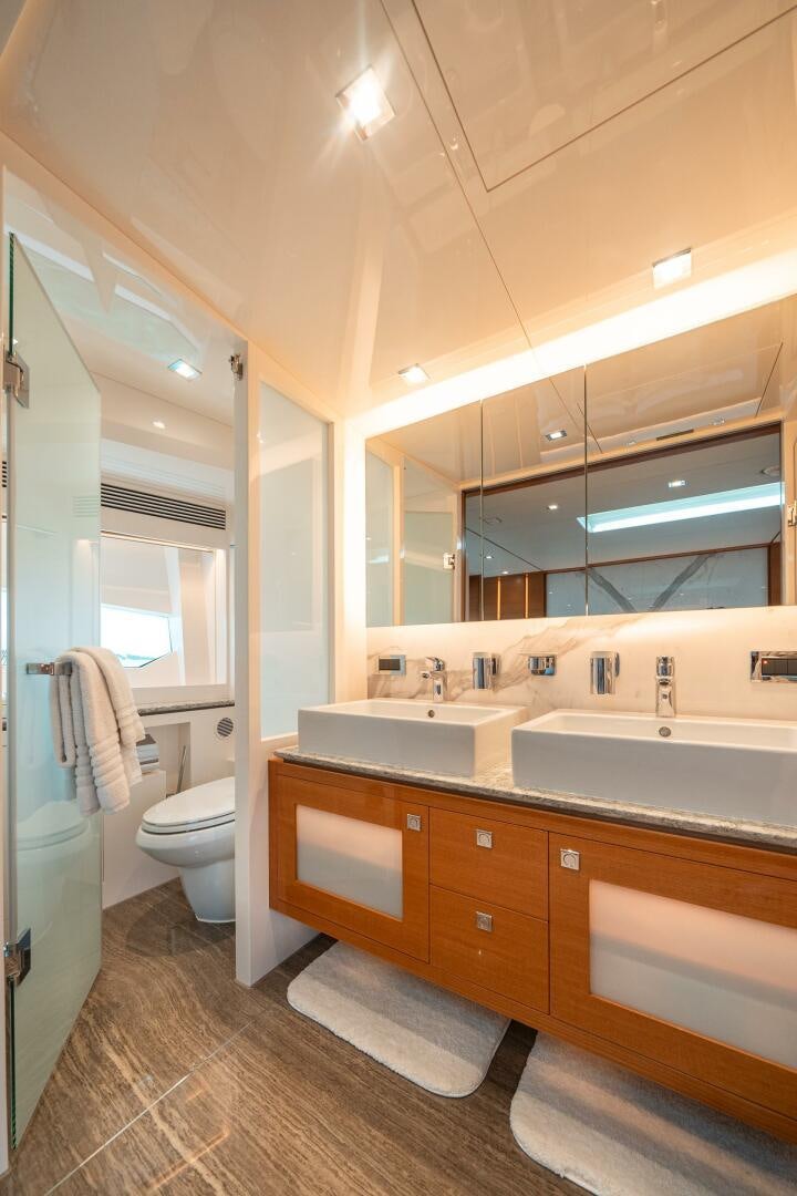 a bathroom with a sink and a toilet aboard MIDNIGHT MOON Yacht for Sale