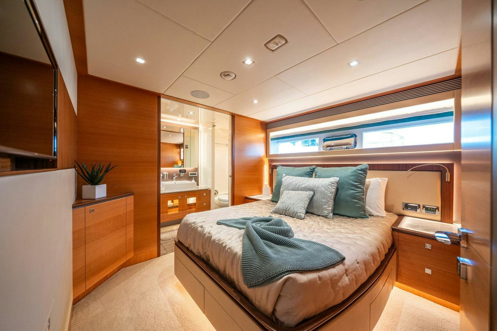 a bedroom with a bed and a desk aboard MIDNIGHT MOON Yacht for Sale