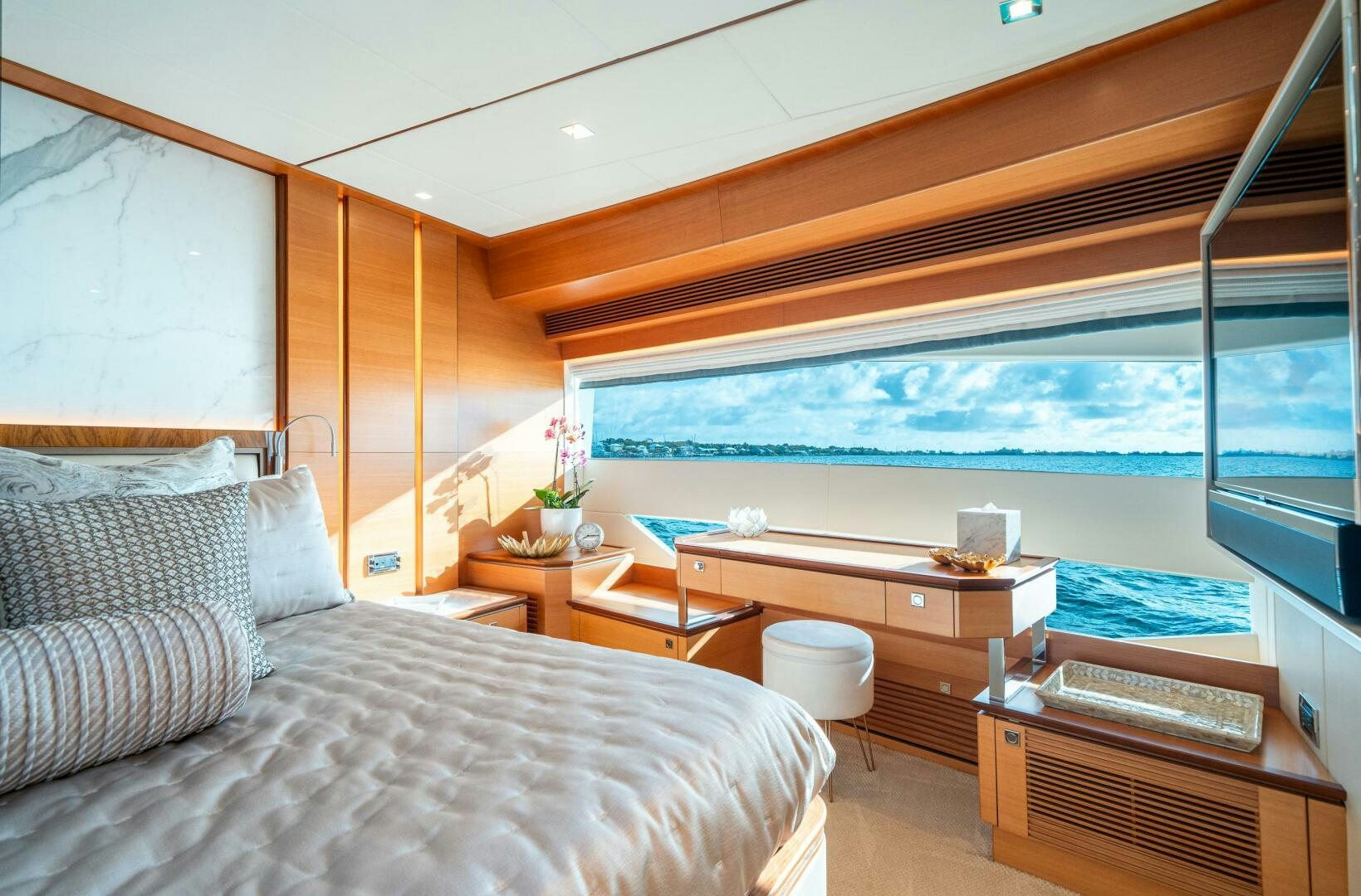 a room with a bed and a desk aboard MIDNIGHT MOON Yacht for Sale