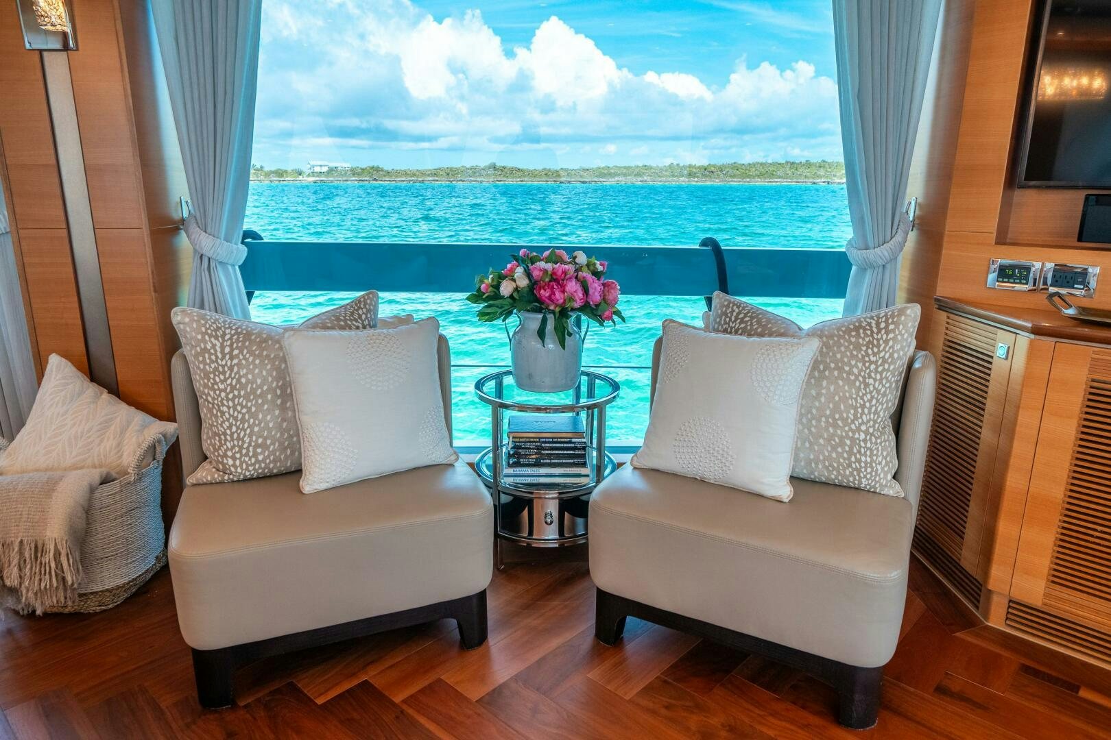 a living room with a view of the ocean aboard MIDNIGHT MOON Yacht for Sale