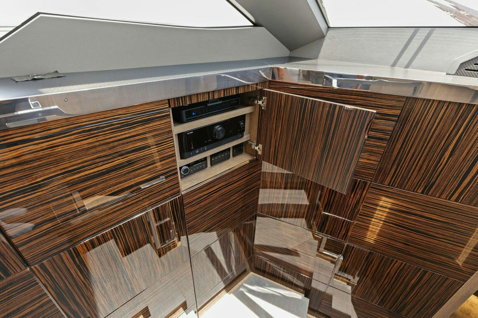 a kitchen with wooden cabinets aboard TINKA BUNNY Yacht for Sale