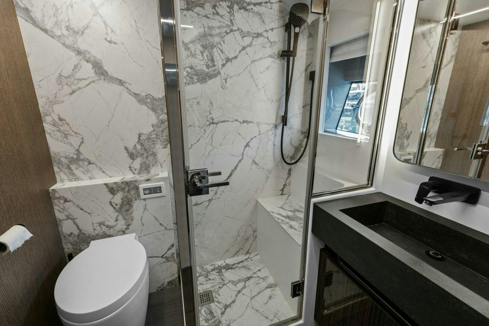 a bathroom with a toilet and a sink aboard TINKA BUNNY Yacht for Sale