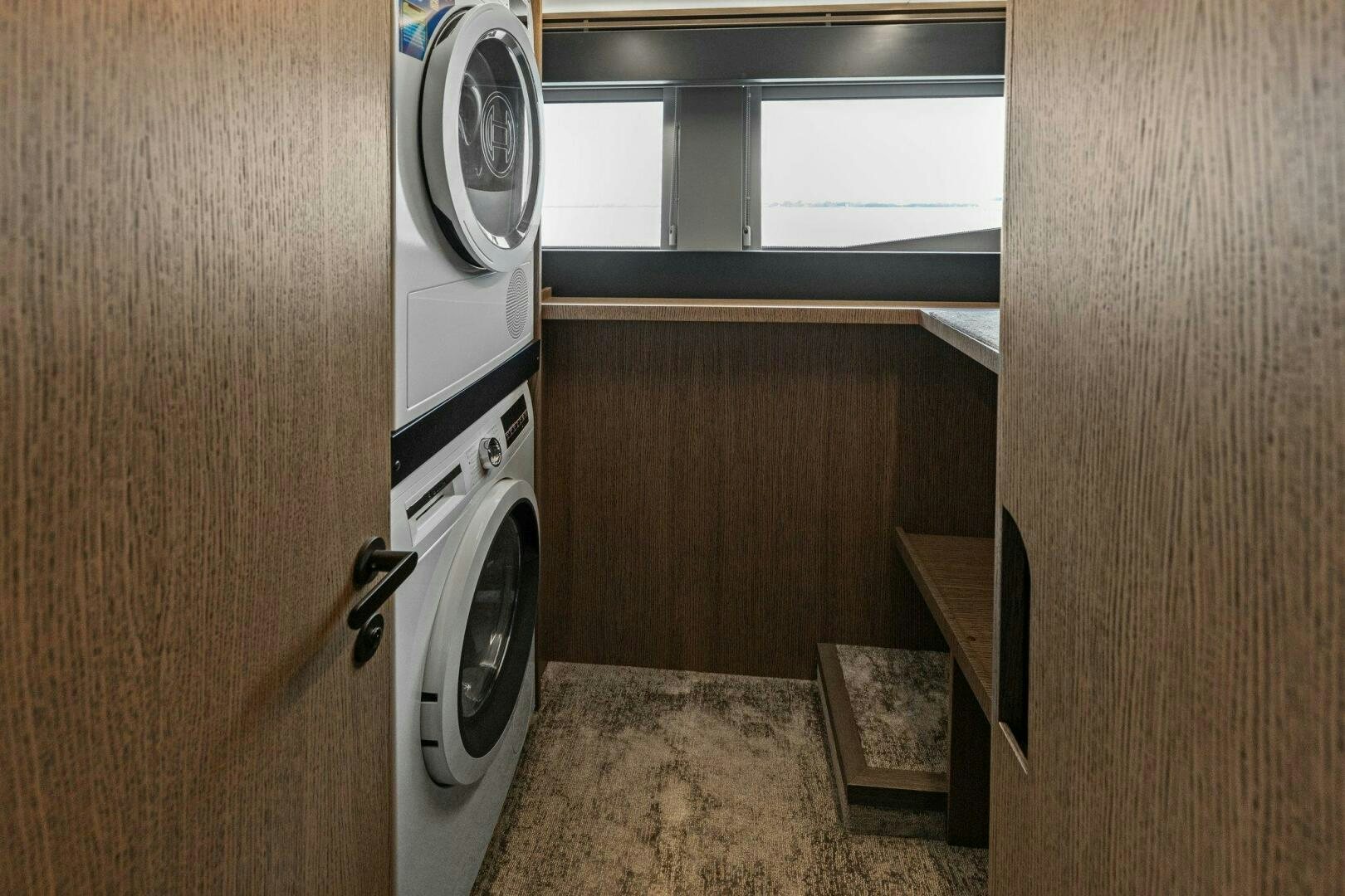 a washer and dryer in a room aboard TINKA BUNNY Yacht for Sale