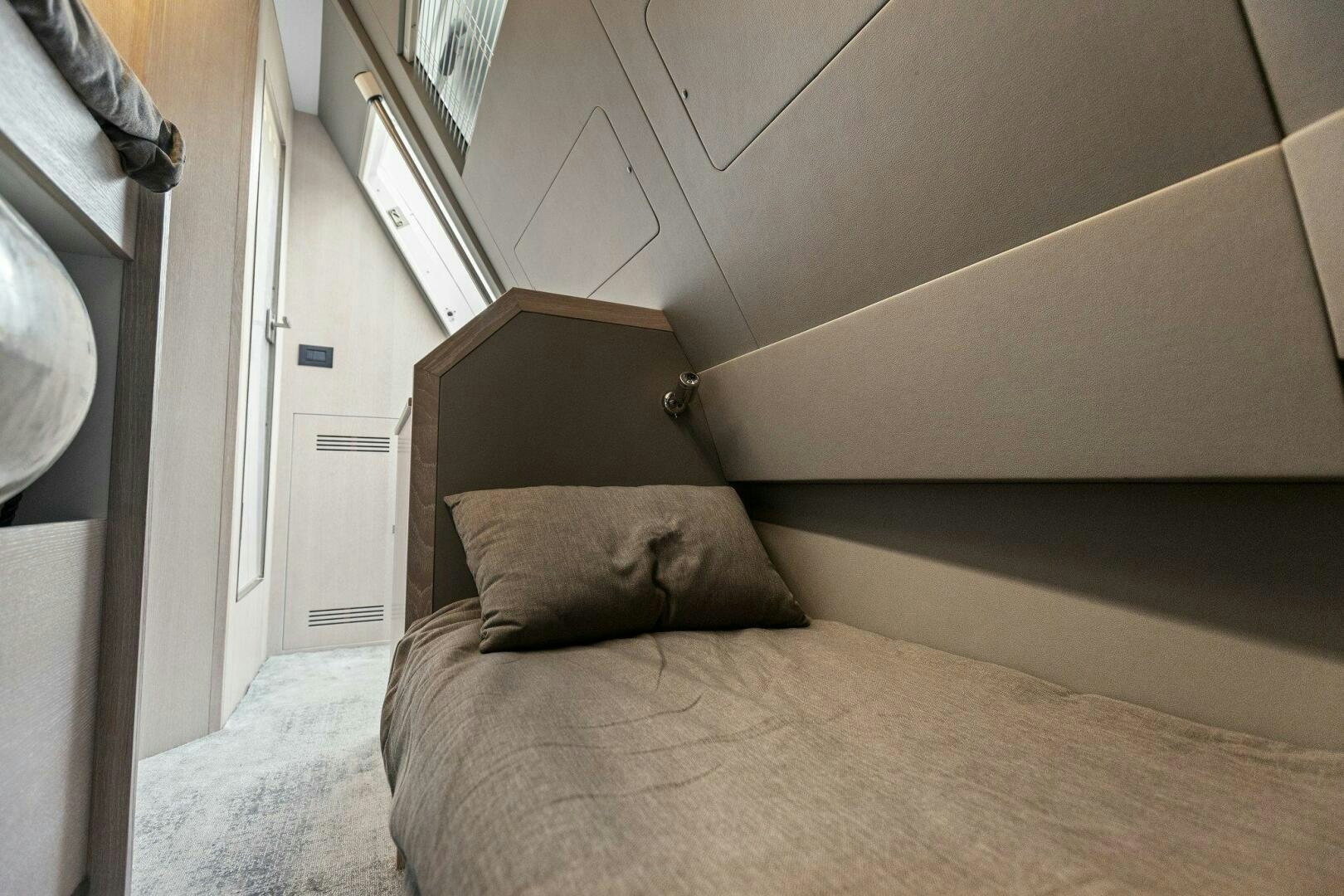 a bed with a pillow on it aboard TINKA BUNNY Yacht for Sale