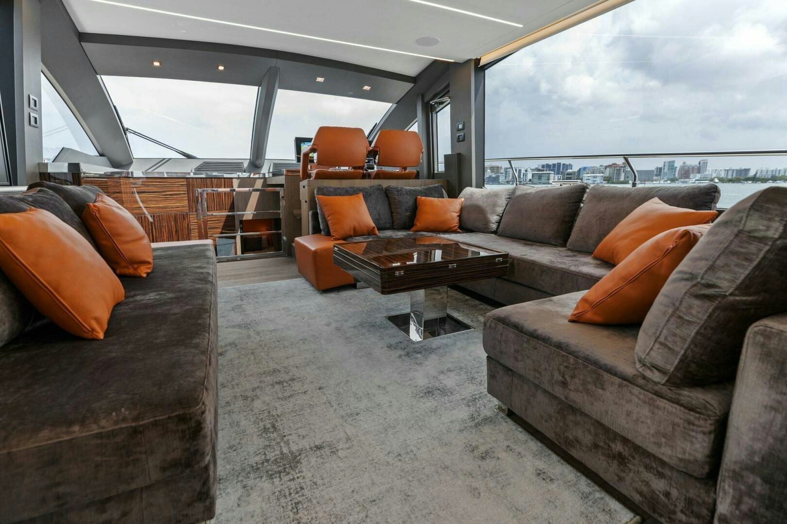 a large living room with couches aboard TINKA BUNNY Yacht for Sale
