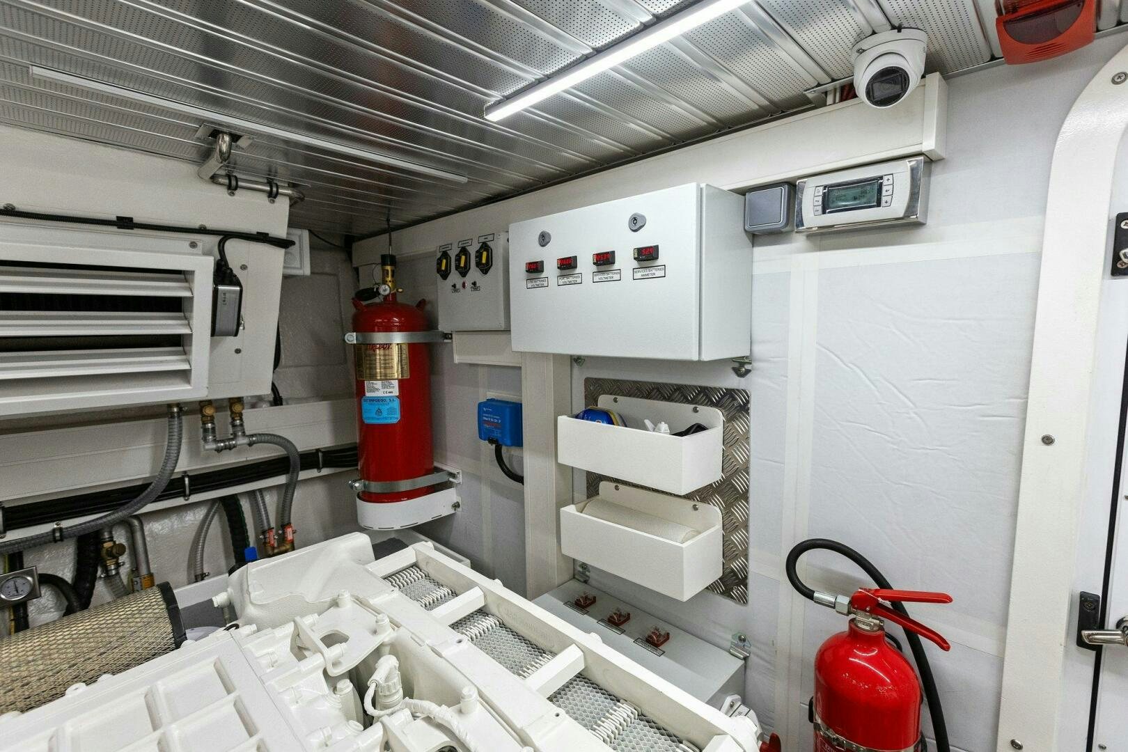 a white machine with a red light aboard TINKA BUNNY Yacht for Sale
