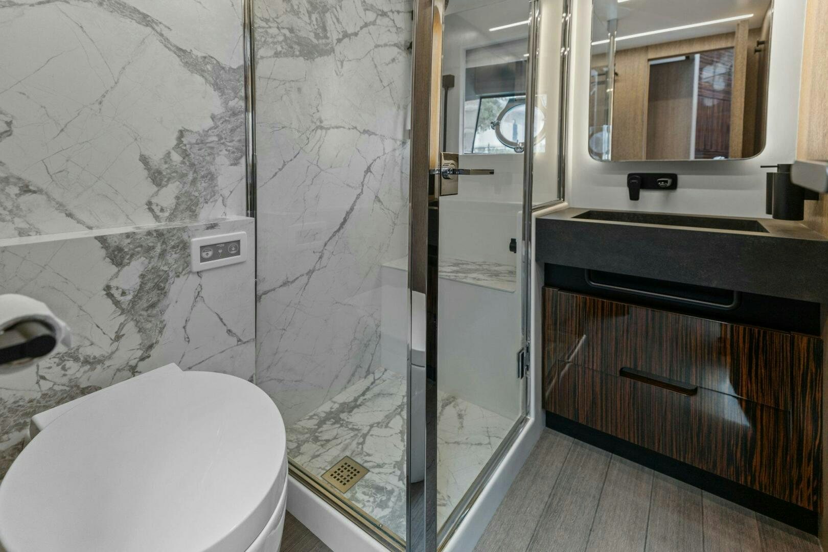 a bathroom with a glass shower aboard TINKA BUNNY Yacht for Sale