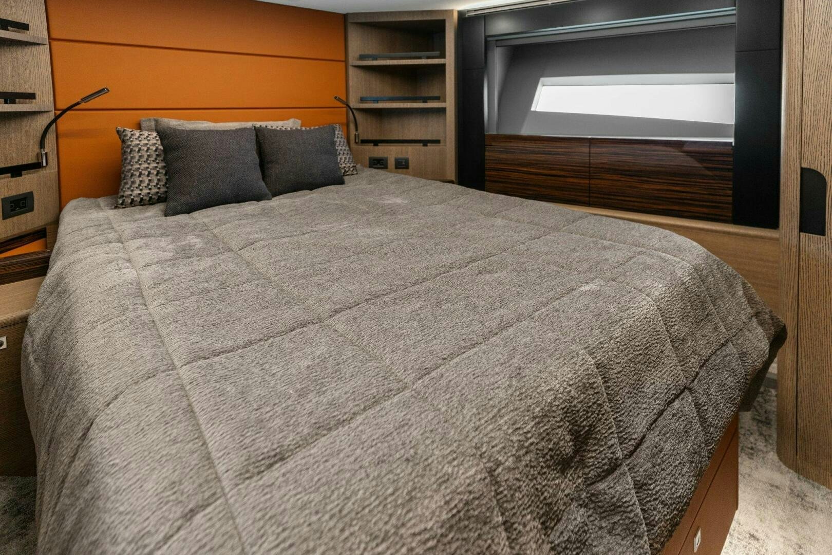 a bed with a white comforter aboard TINKA BUNNY Yacht for Sale