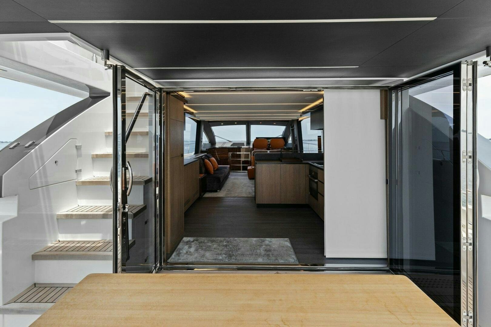 a room with a staircase and a glass door aboard TINKA BUNNY Yacht for Sale