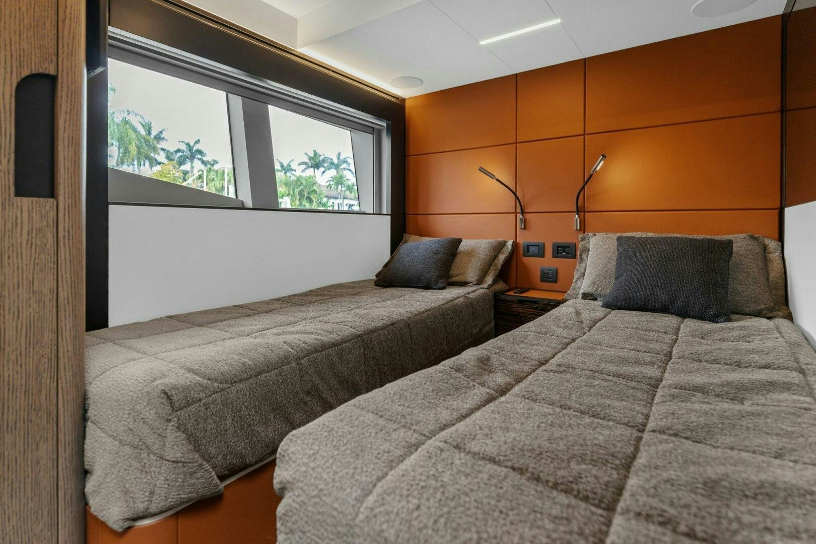 a bedroom with two beds aboard TINKA BUNNY Yacht for Sale