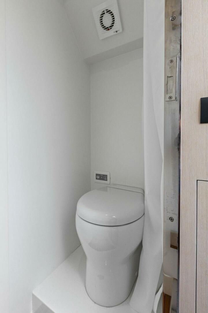 a toilet in a bathroom aboard TINKA BUNNY Yacht for Sale