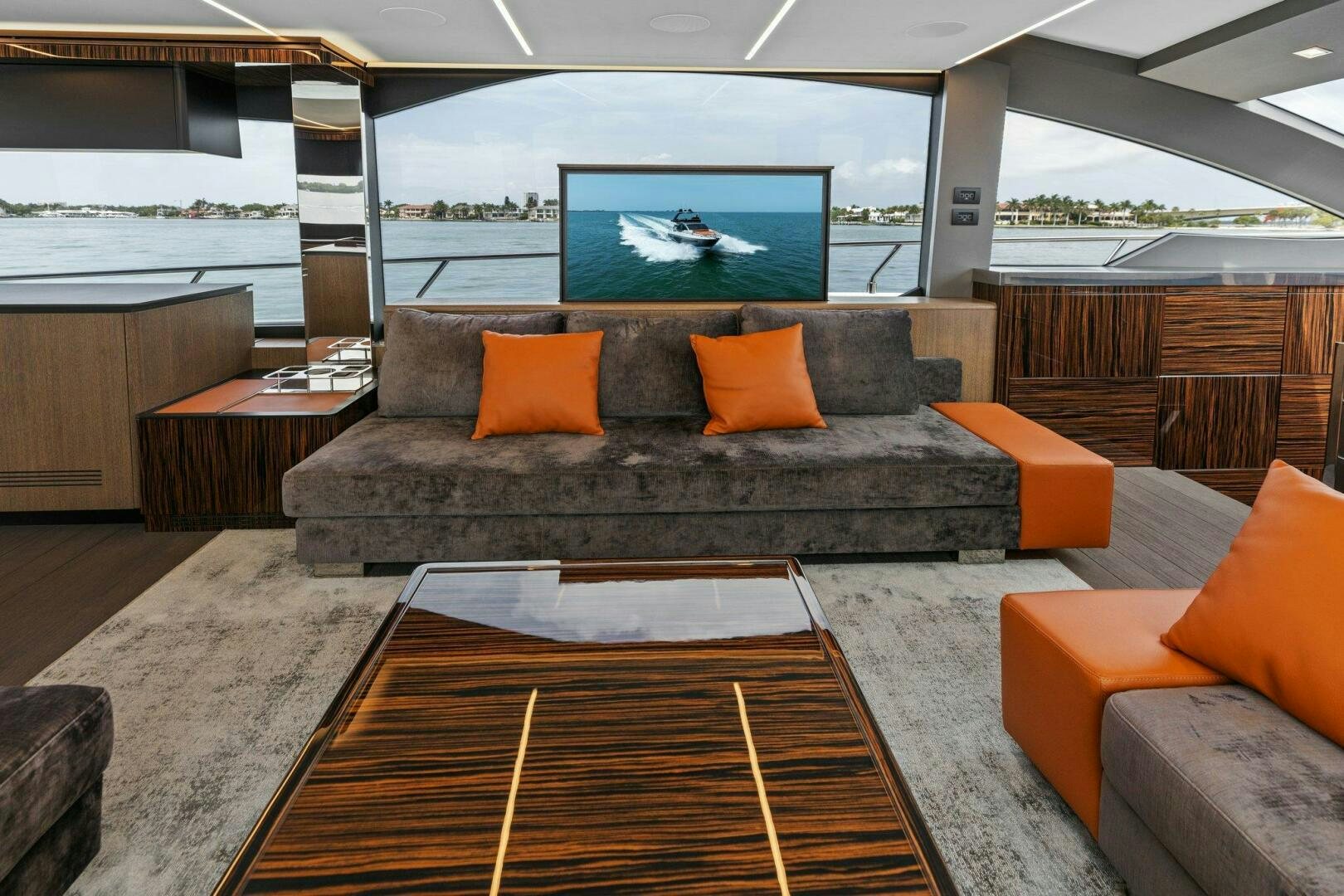 a living room with a large couch aboard TINKA BUNNY Yacht for Sale