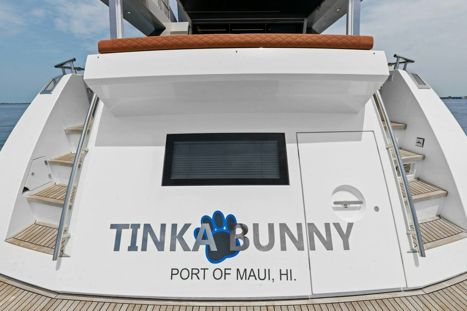 a white building with a sign aboard TINKA BUNNY Yacht for Sale