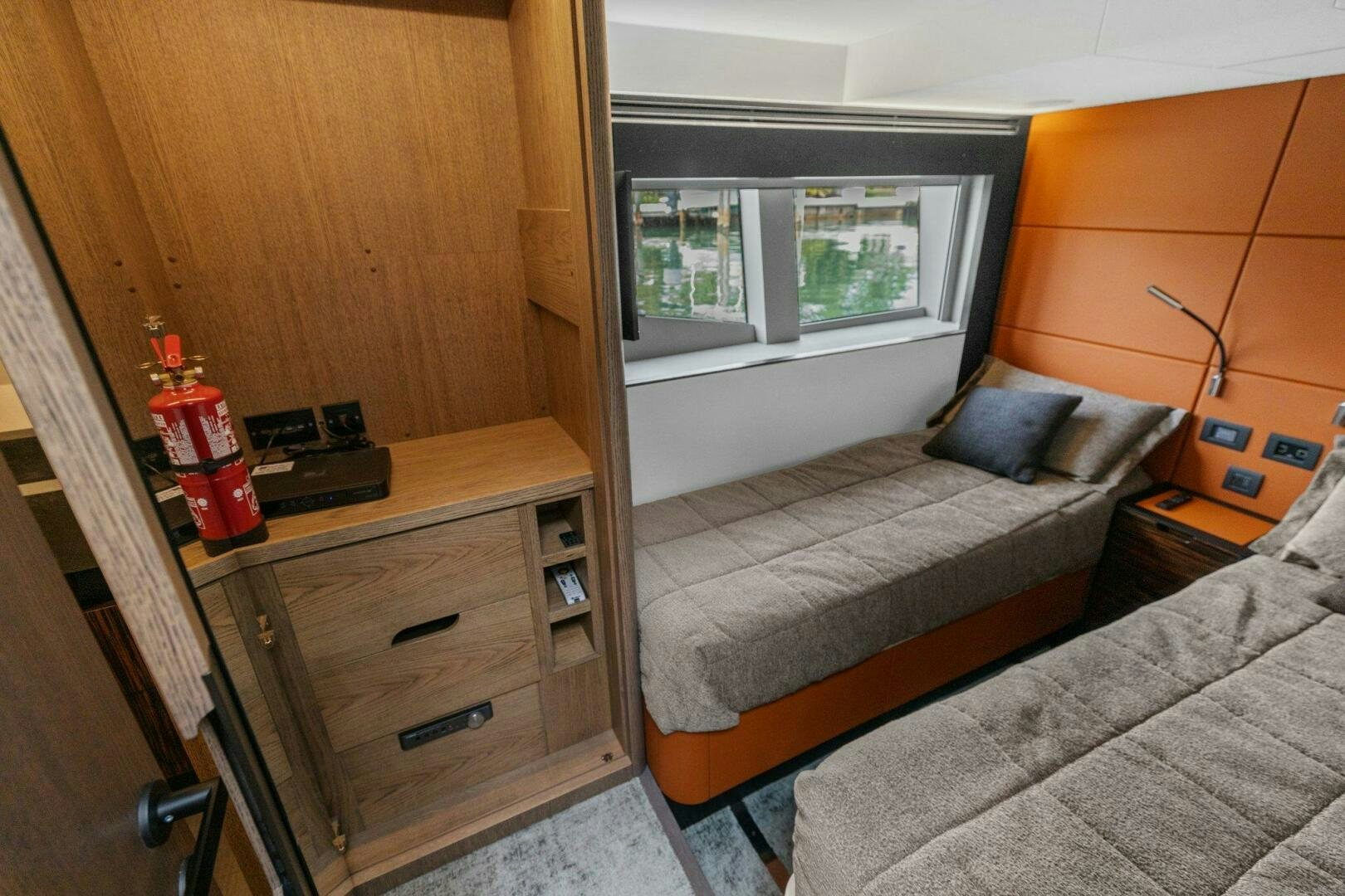 a bedroom with a bed and a desk aboard TINKA BUNNY Yacht for Sale