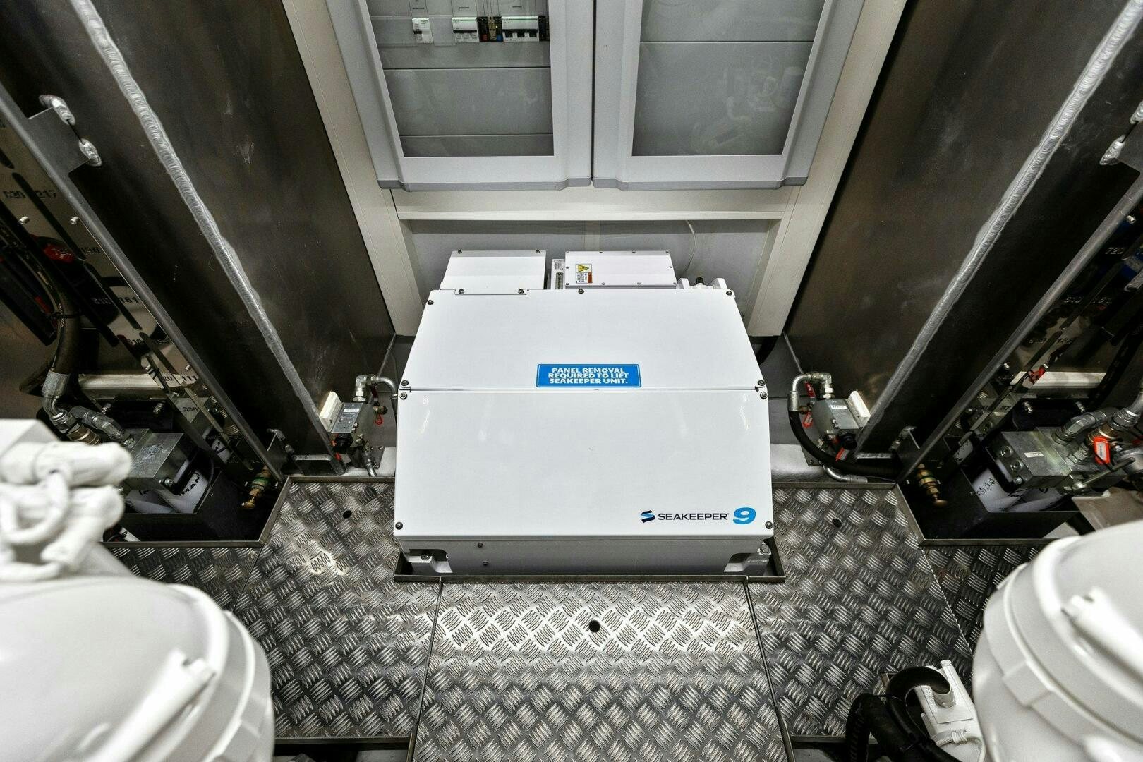 a white box on a tile floor aboard TINKA BUNNY Yacht for Sale