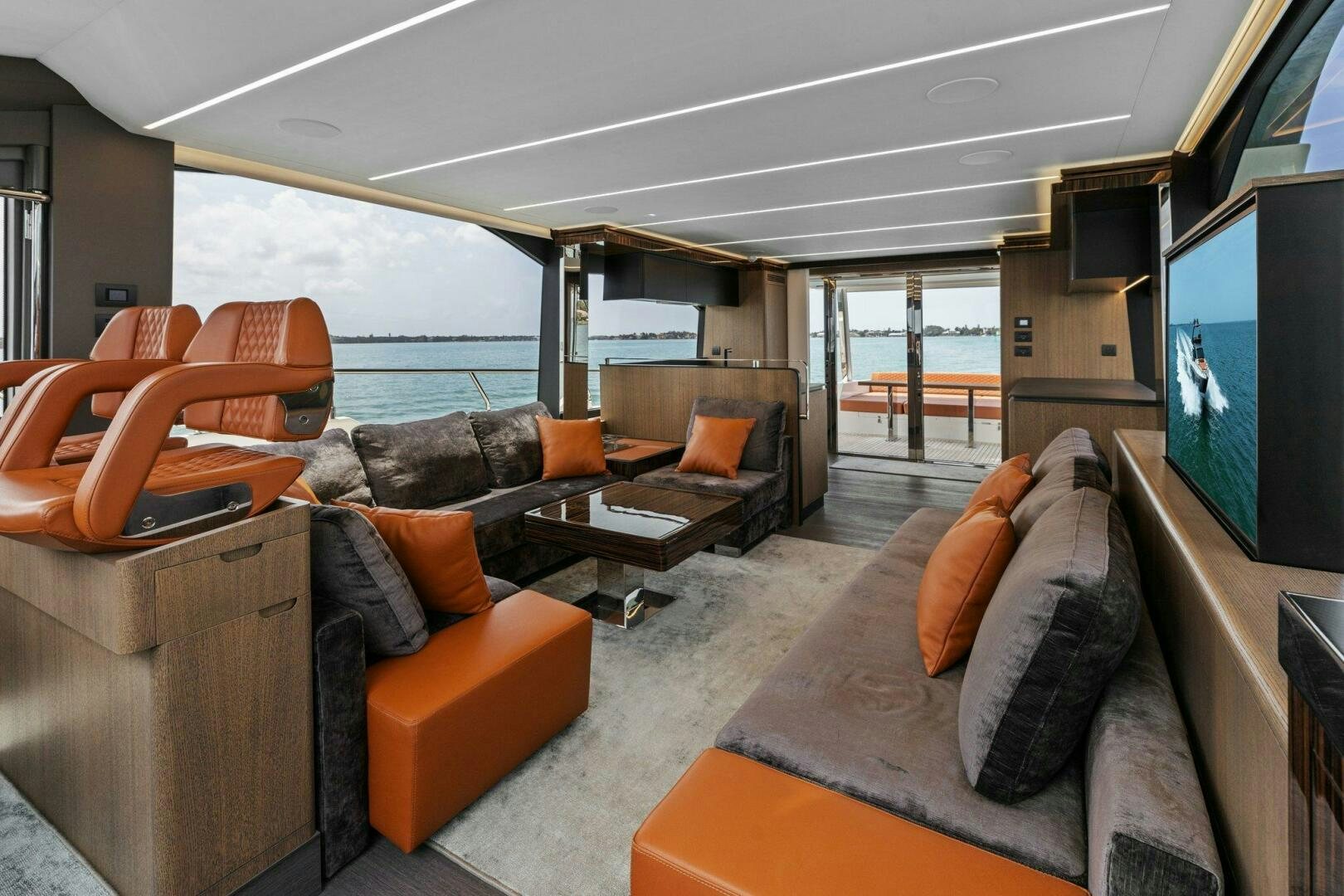 a living room with a large screen aboard TINKA BUNNY Yacht for Sale