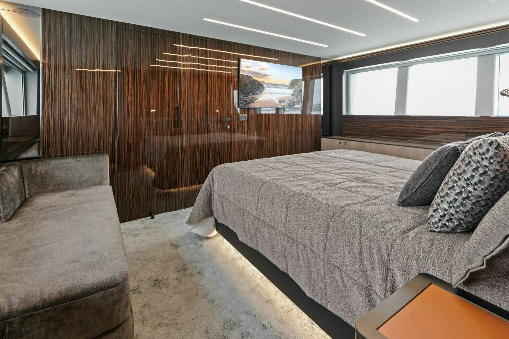 a bedroom with a bed and a couch aboard TINKA BUNNY Yacht for Sale