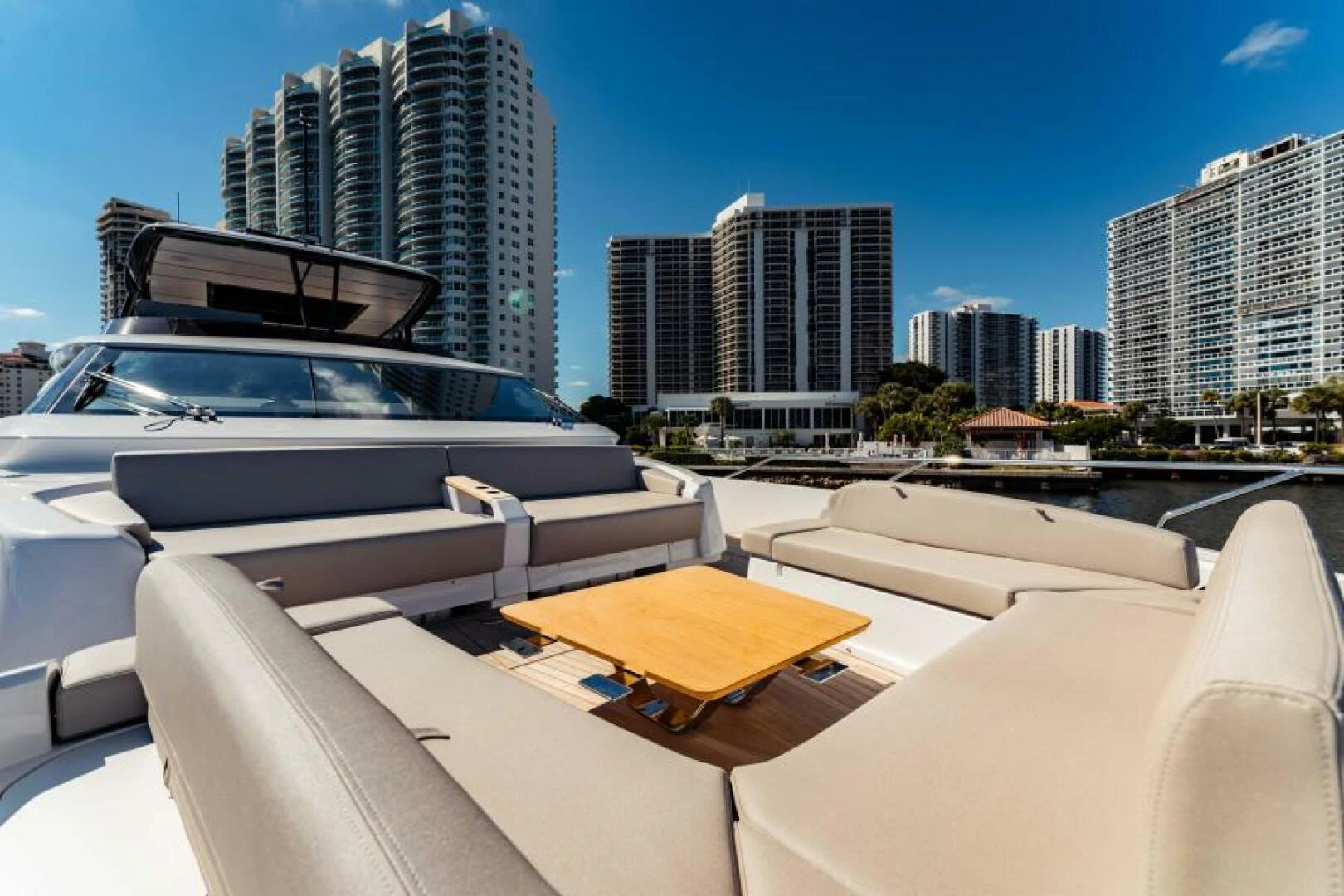 a rooftop with a boat and a city in the background aboard INEA Yacht for Sale