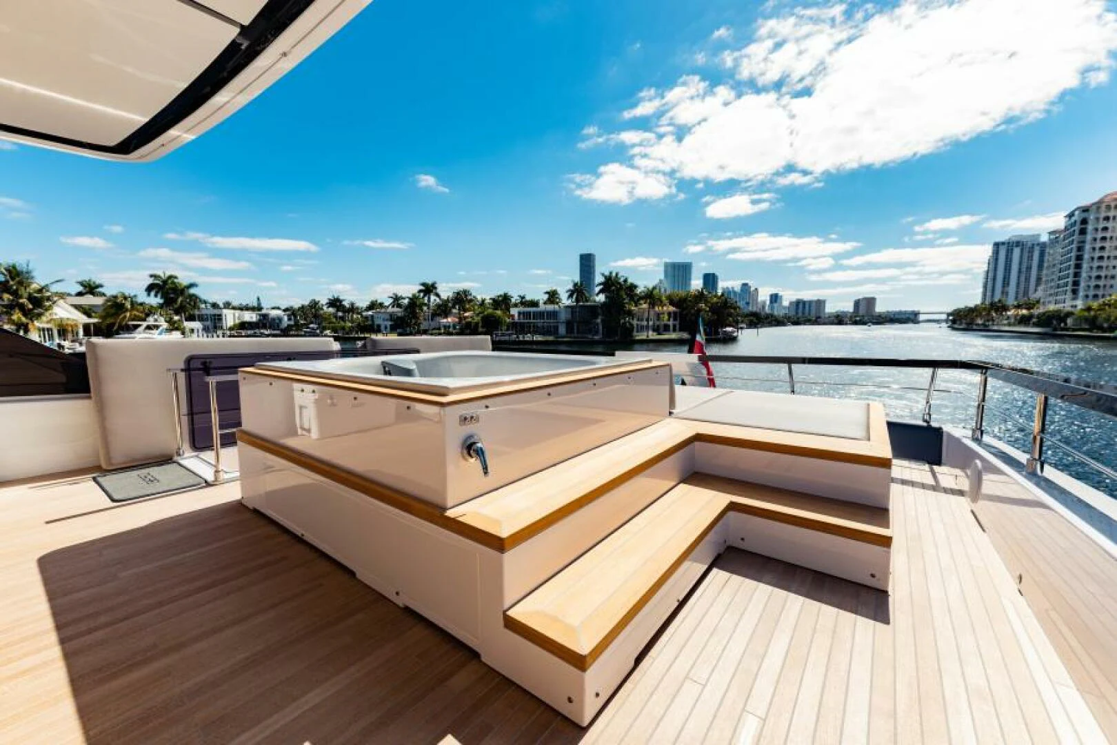 a deck with a view of a city and water aboard INEA Yacht for Sale